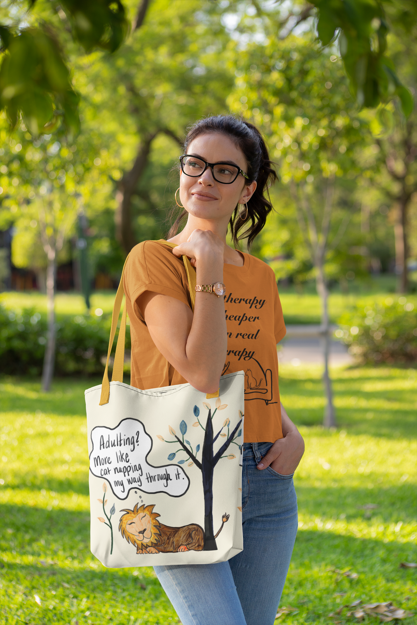Woman carrying Adulting Nap Lion all-over print tote bag with yellow straps in park – sarcastic lazy vibes tote by GrungePup Sarcastic Affirmations