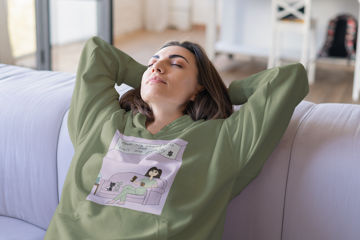 Woman relaxing with head back on couch wearing military green "Feed Me Chocolate and Call Me Pretty" hoodie – GrungePup Sarcastic Affirmations