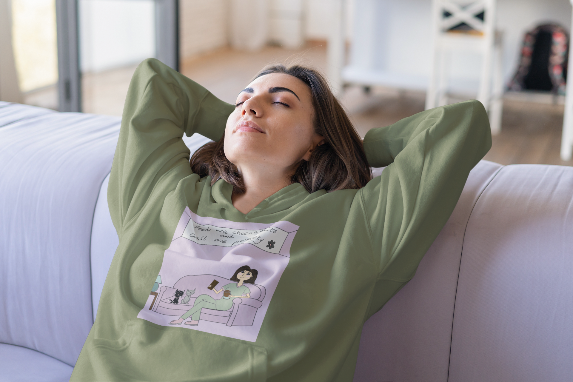 Woman relaxing with head back on couch wearing military green "Feed Me Chocolate and Call Me Pretty" hoodie – GrungePup Sarcastic Affirmations