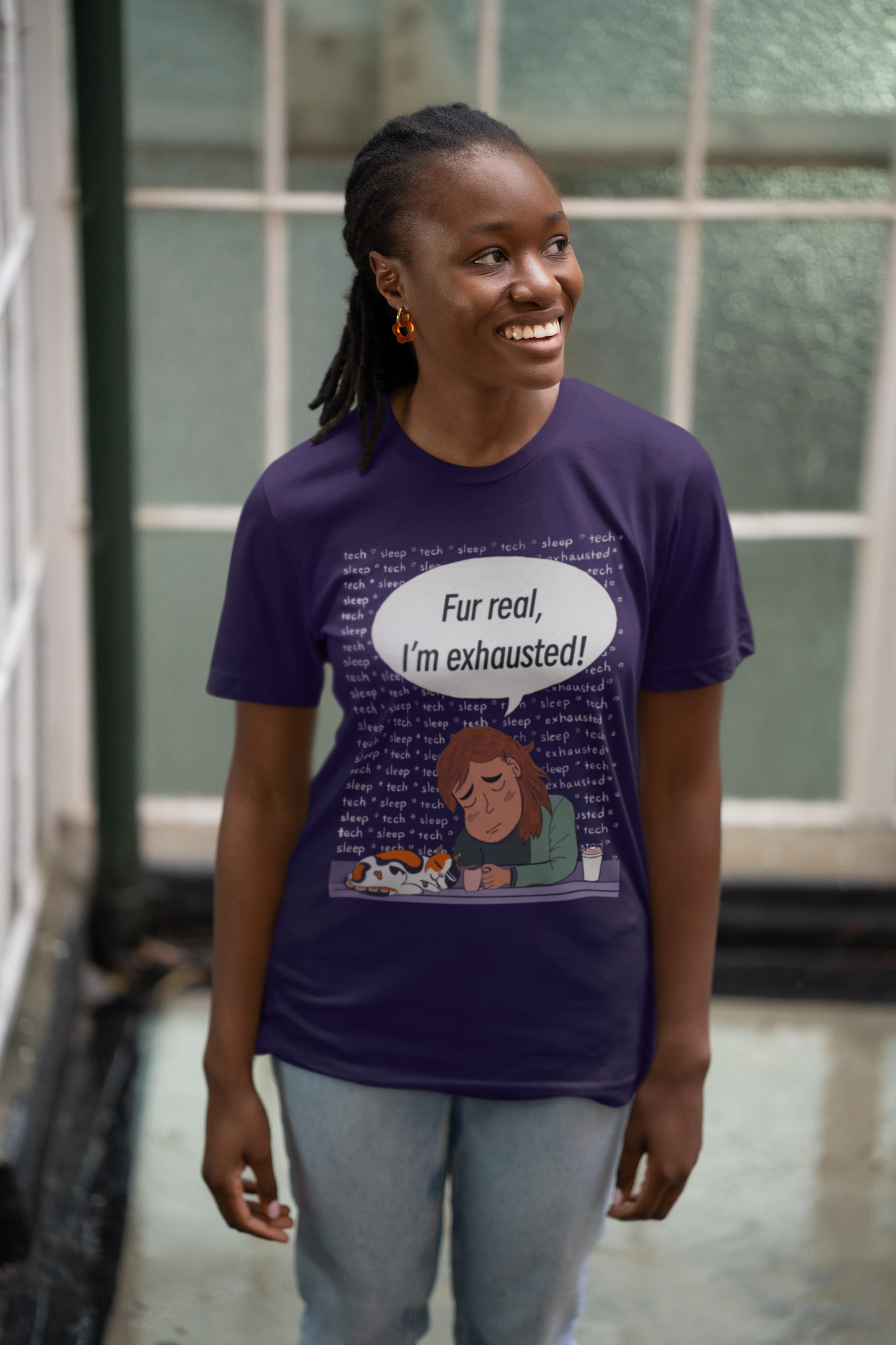 Woman posing against window in team purple Bella Canvas t-shirt showing "Fur Real, I'm Exhausted" colorful design. Relatable burnt-out vet tech humor with a cute tired dog illustration.