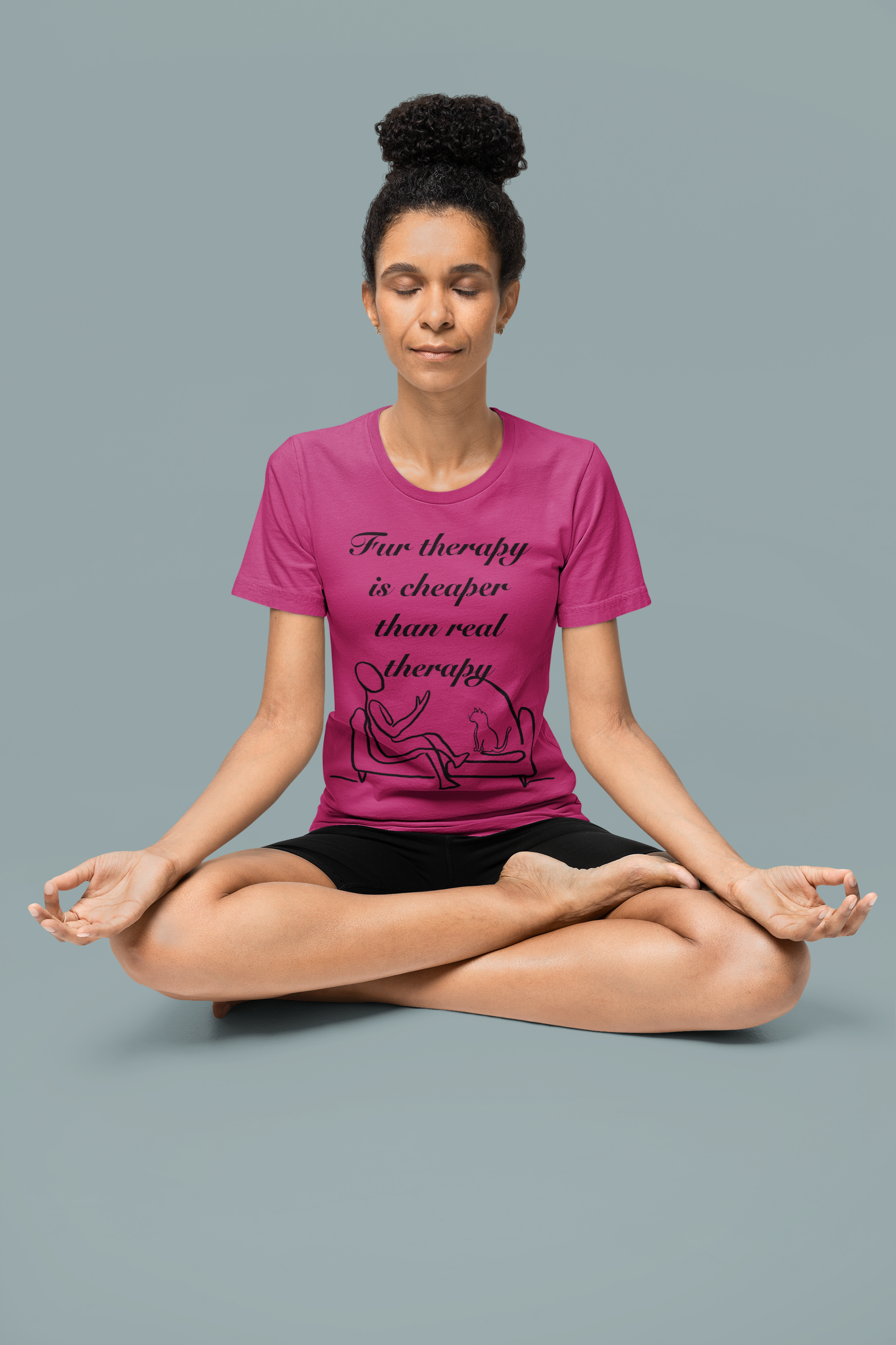 Woman sitting in yoga meditation pose wearing berry colored Fur Therapy is Cheaper Than Real Therapy black ink cat t-shirt