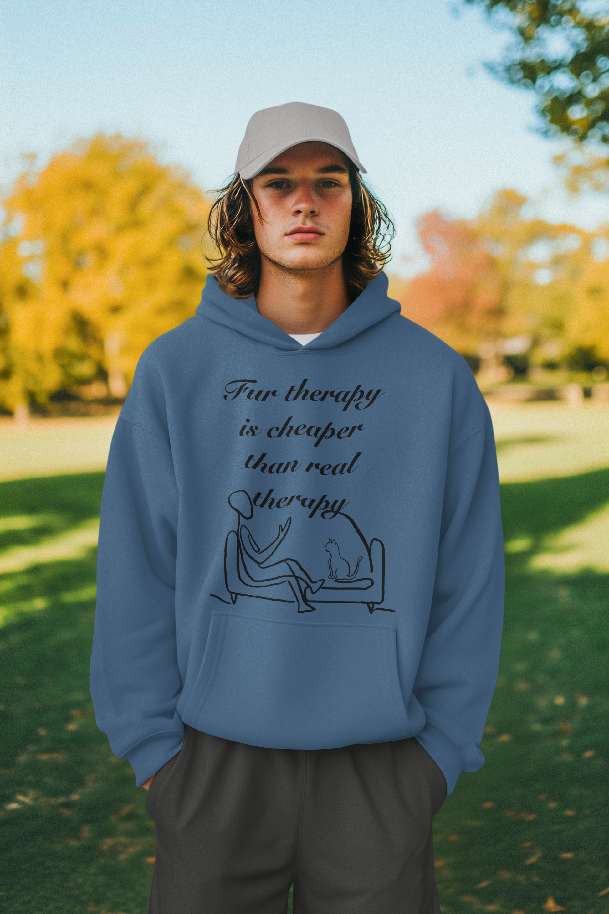 Man in park wearing indigo blue Fur Therapy Is Cheaper Than Real Therapy black ink cat hoodie – sarcastic pet therapy humor by GrungePup Sarcastic Affirmations