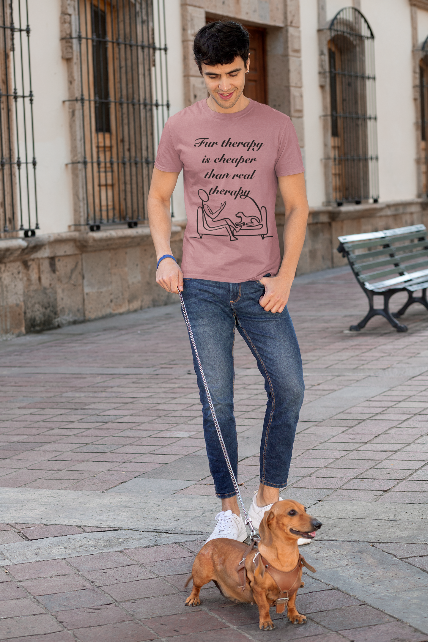 Man standing outdoors with his dog while wearing heather orchid Fur Therapy is Cheaper Than Real Therapy t-shirt
