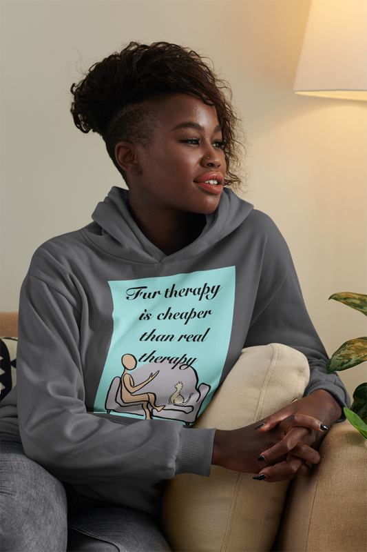 Woman with afro hairstyle wearing dark heather Fur Therapy Is Cheaper Than Real Therapy colored cat hoodie, sitting on couch – sarcastic affirmation design by GrungePup Sarcastic Affirmations