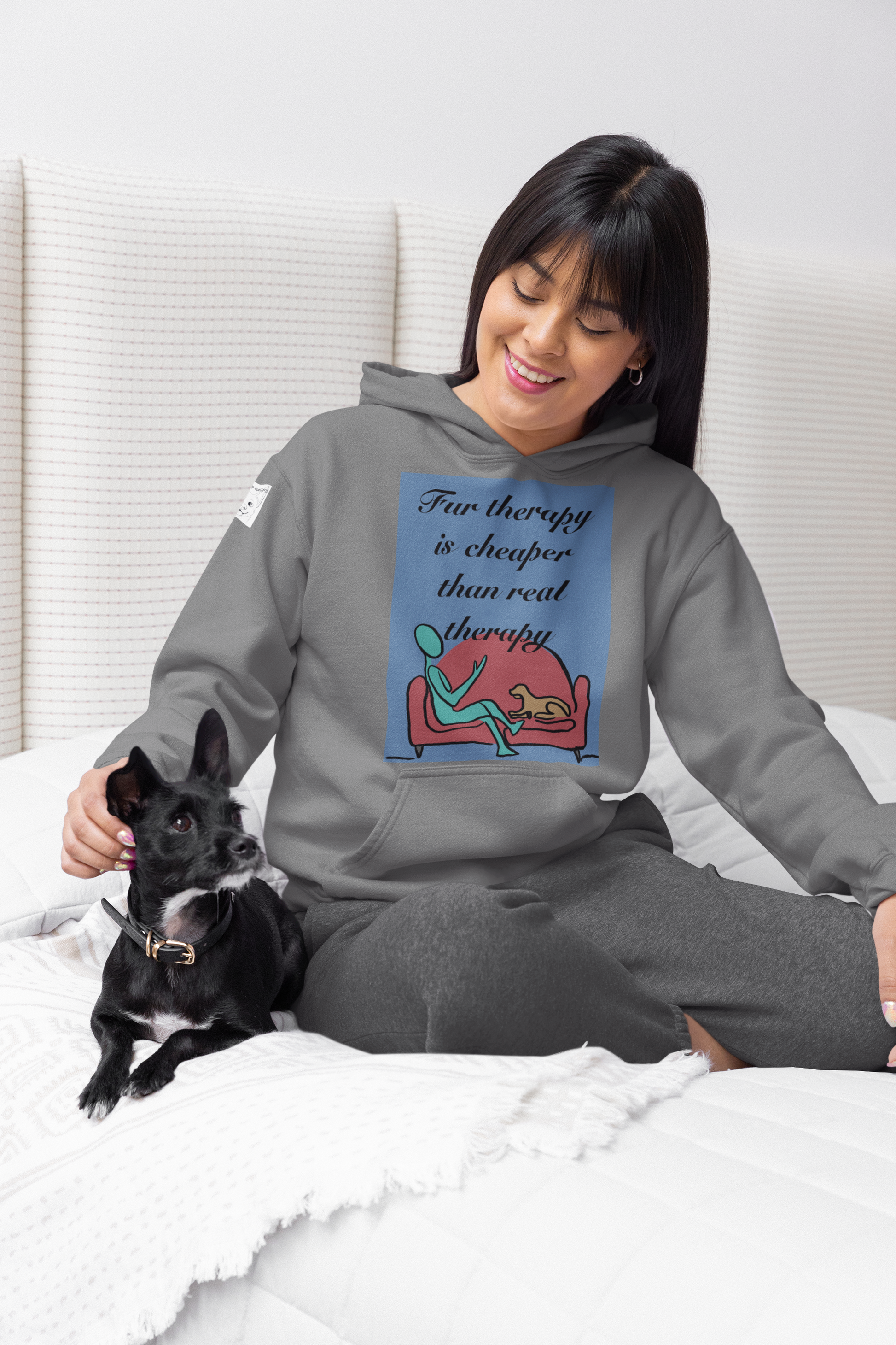 Woman sitting on bed with black and white small dog wearing graphite heather Fur Therapy Is Cheaper Than Real Therapy colored dog hoodie – funny pet therapy design by GrungePup Sarcastic Affirmations