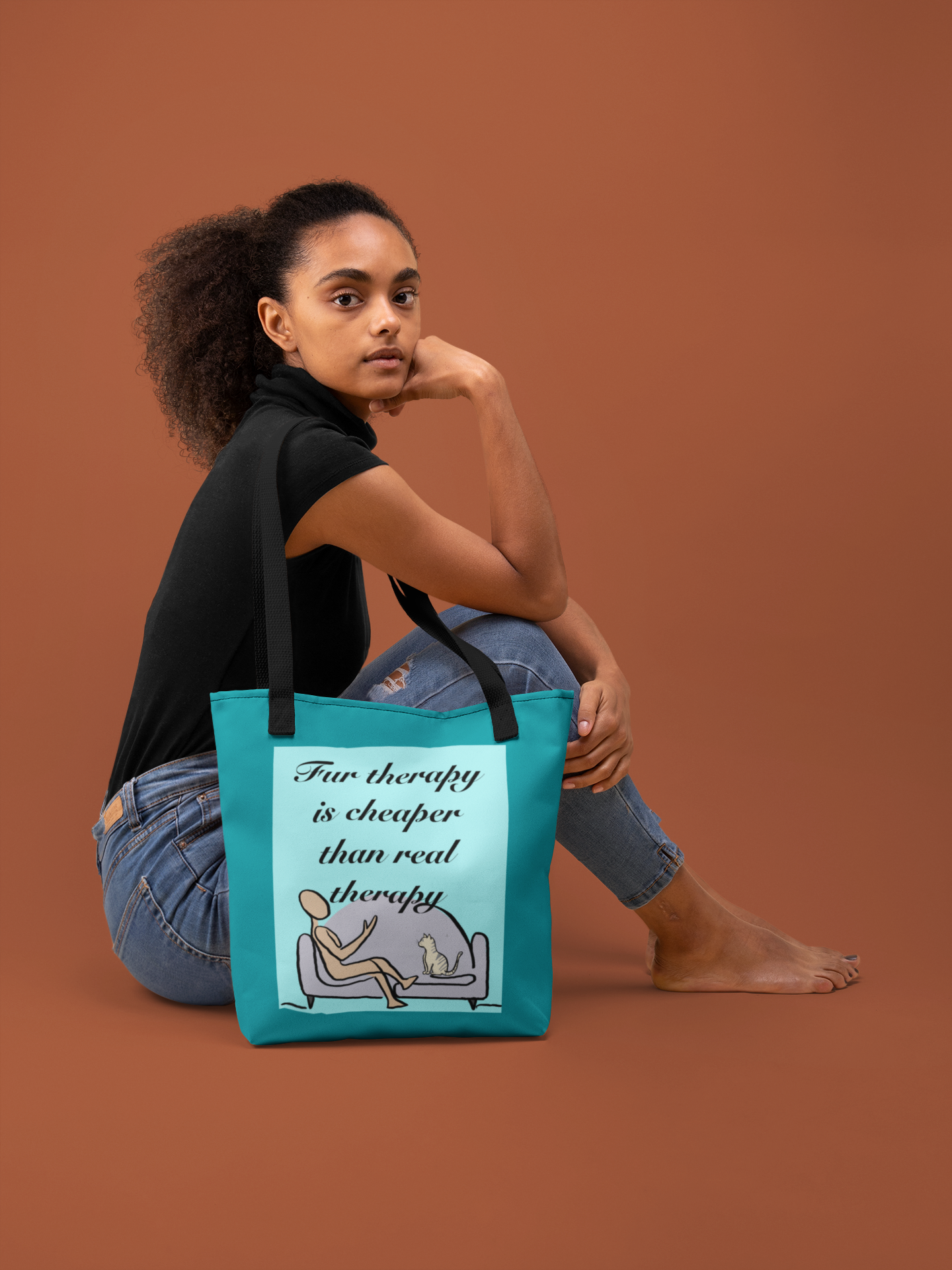 Woman sitting on floor holding Fur Therapy Is Cheaper Than Real Therapy tote bag with black straps – sarcastic lazy vibes affirmation accessory by GrungePup Sarcastic Affirmations