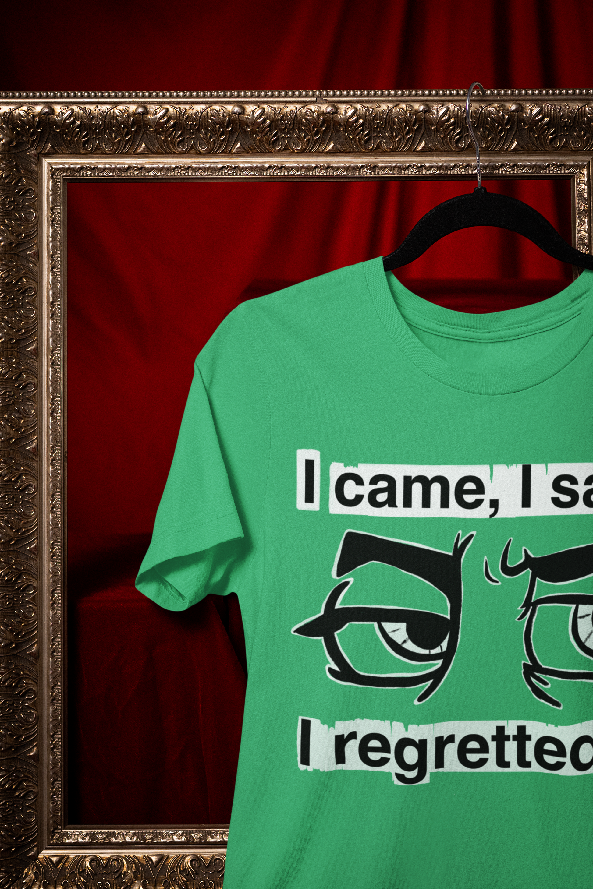 Heather Irish green Gildan Softstyle t-shirt with I Came I Saw I Regretted It eye-roll design hanging on a black hanger