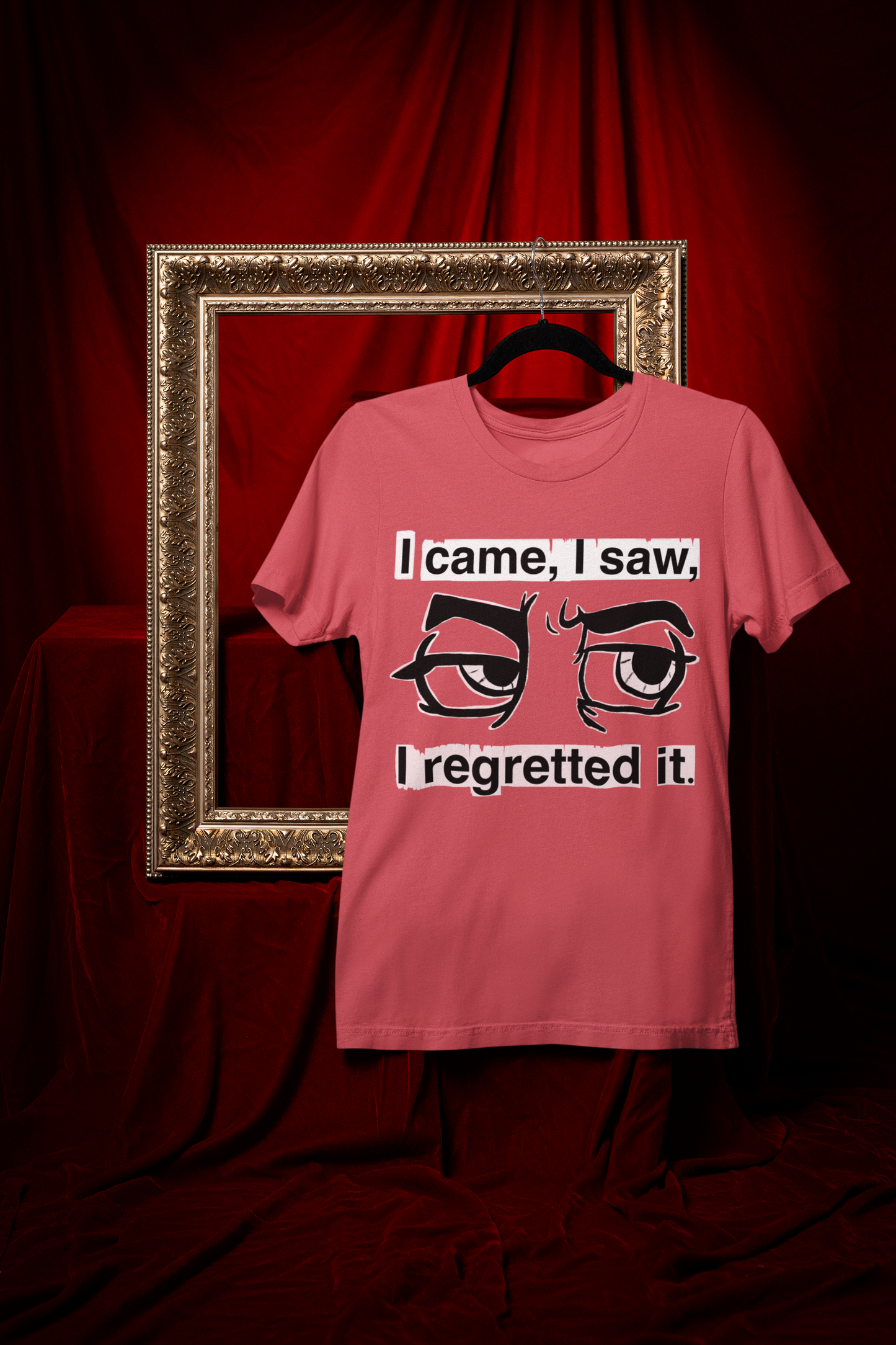 Heather red Gildan Softstyle t-shirt with I Came I Saw I Regretted It eye-roll design hanging on a black hanger