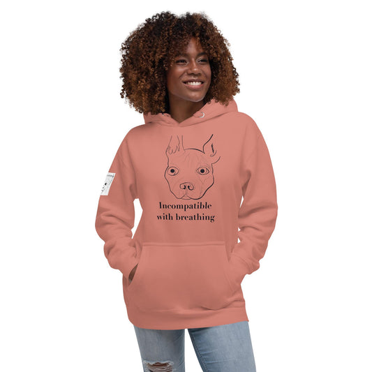 Woman with curly hair wearing dusty rose "Incompatible with Breathing" hoodie with French Bulldog line drawing – GrungePup Vet Chaos sarcastic apparel