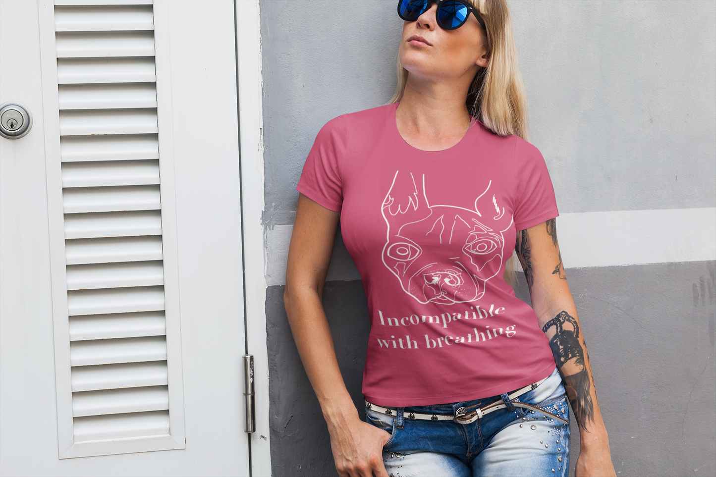 Woman with blonde hair and sunglasses wearing heather raspberry "Incompatible with Breathing" t-shirt with white ink French Bulldog – GrungePup Vet Chaos brachycephalic humor