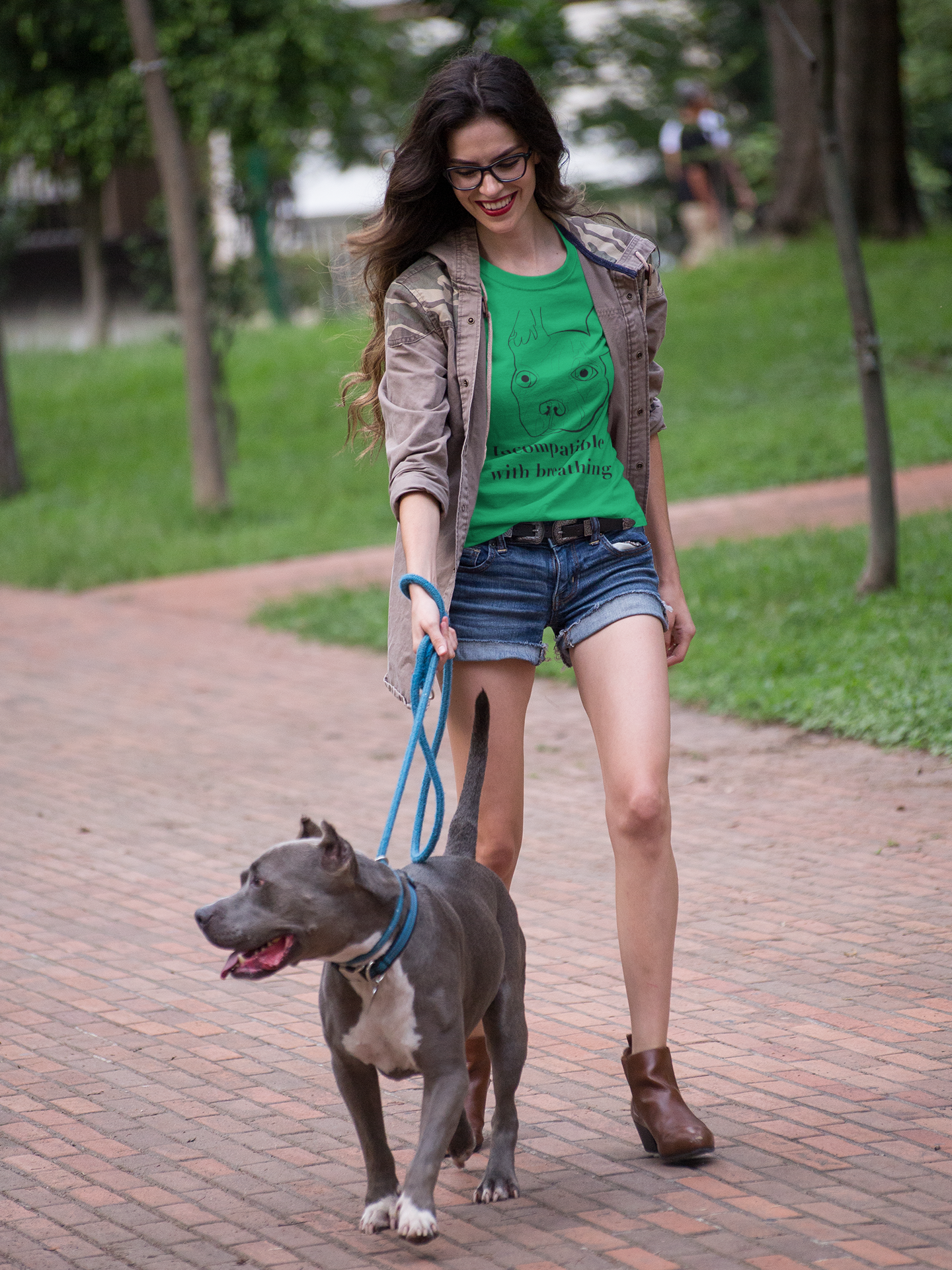 Woman walking dog wearing Irish green "Incompatible with Breathing" t-shirt with French Bulldog illustration – GrungePup Vet Chaos brachycephalic humor