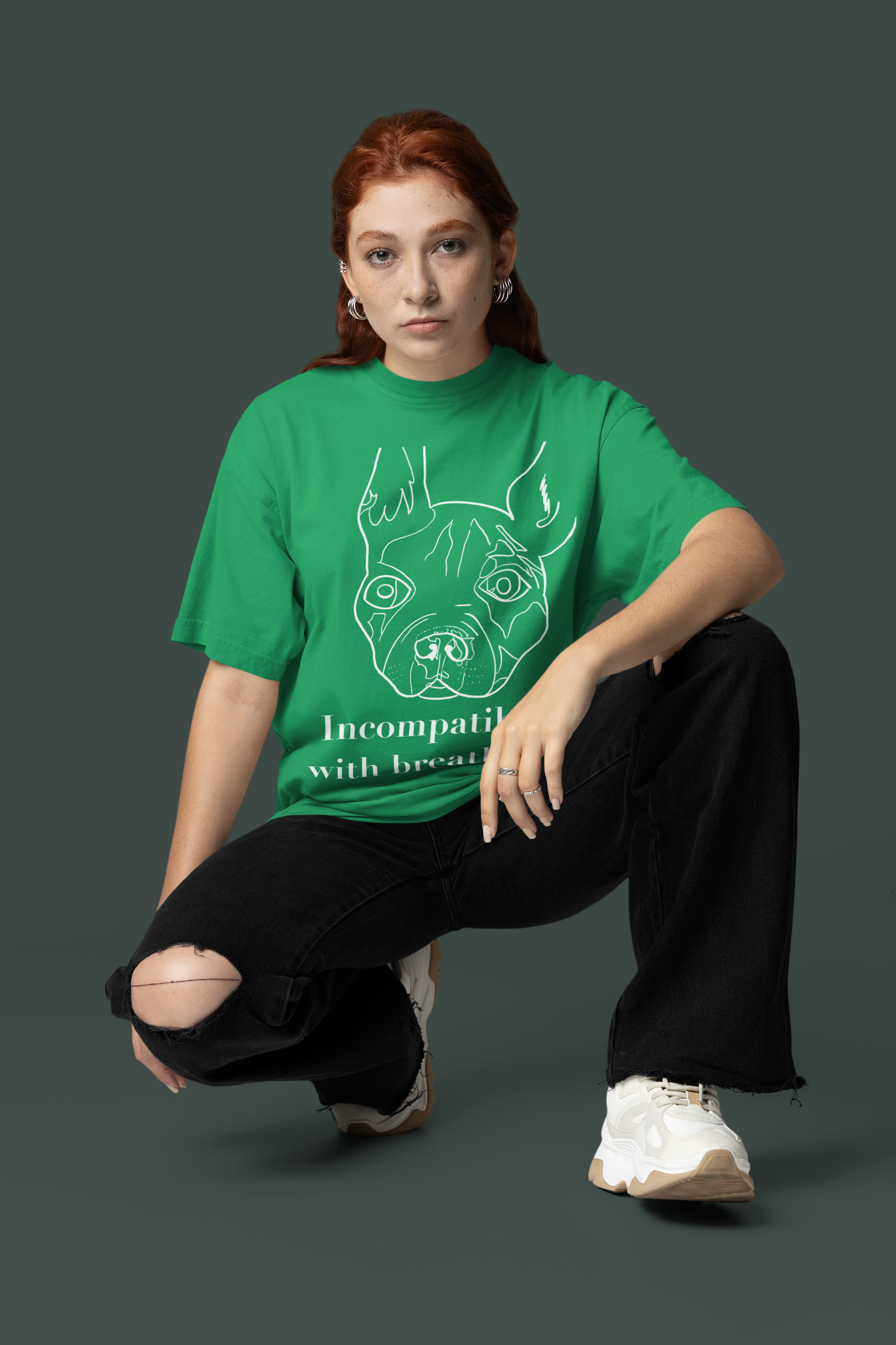 Woman wearing kelly green "Incompatible with Breathing" t-shirt with white ink French Bulldog design – GrungePup Vet Chaos vet med humor apparel