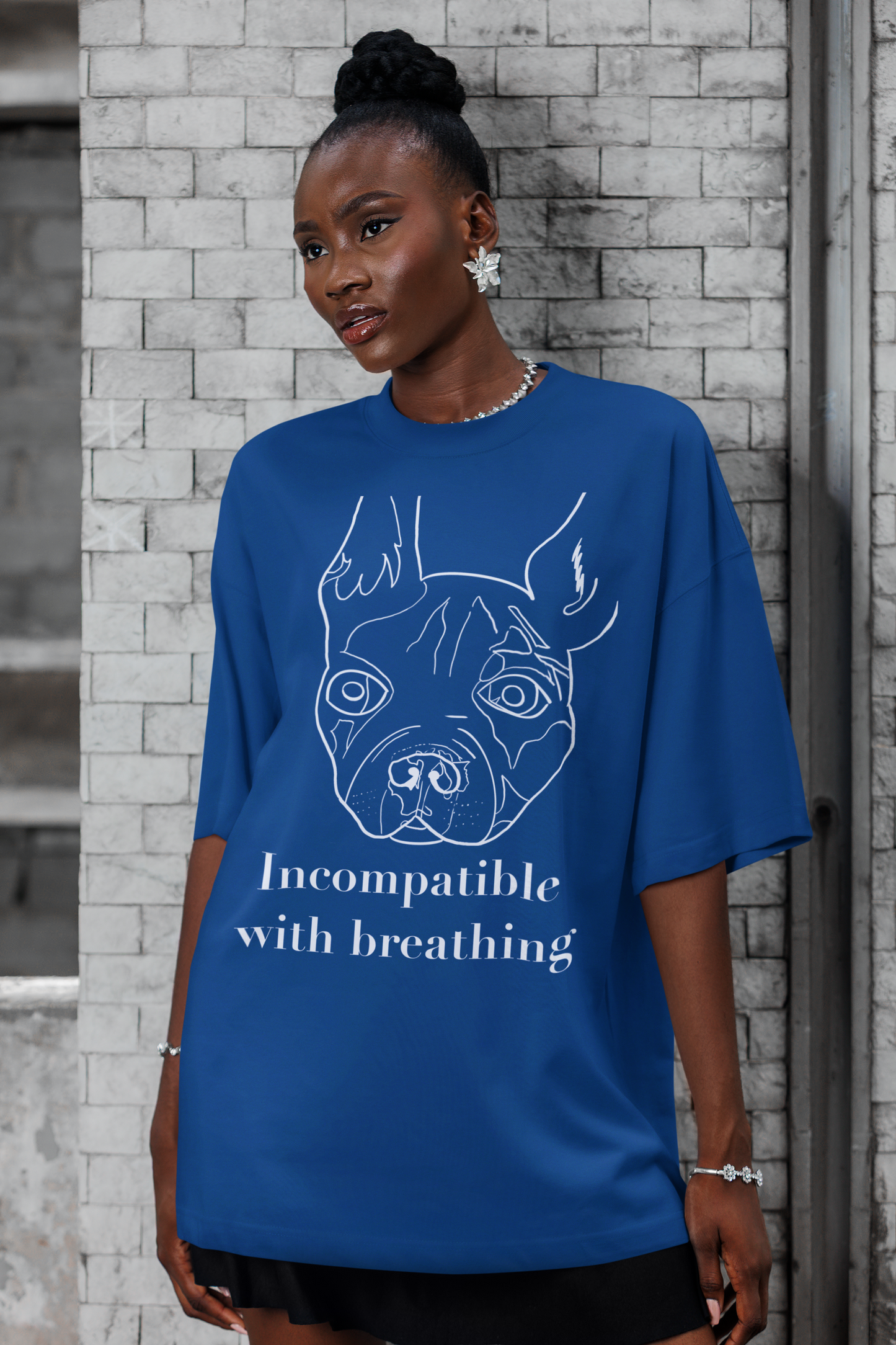 Woman with dark skin wearing true royal blue "Incompatible with Breathing" t-shirt with white ink French Bulldog design – GrungePup Vet Chaos humor tee