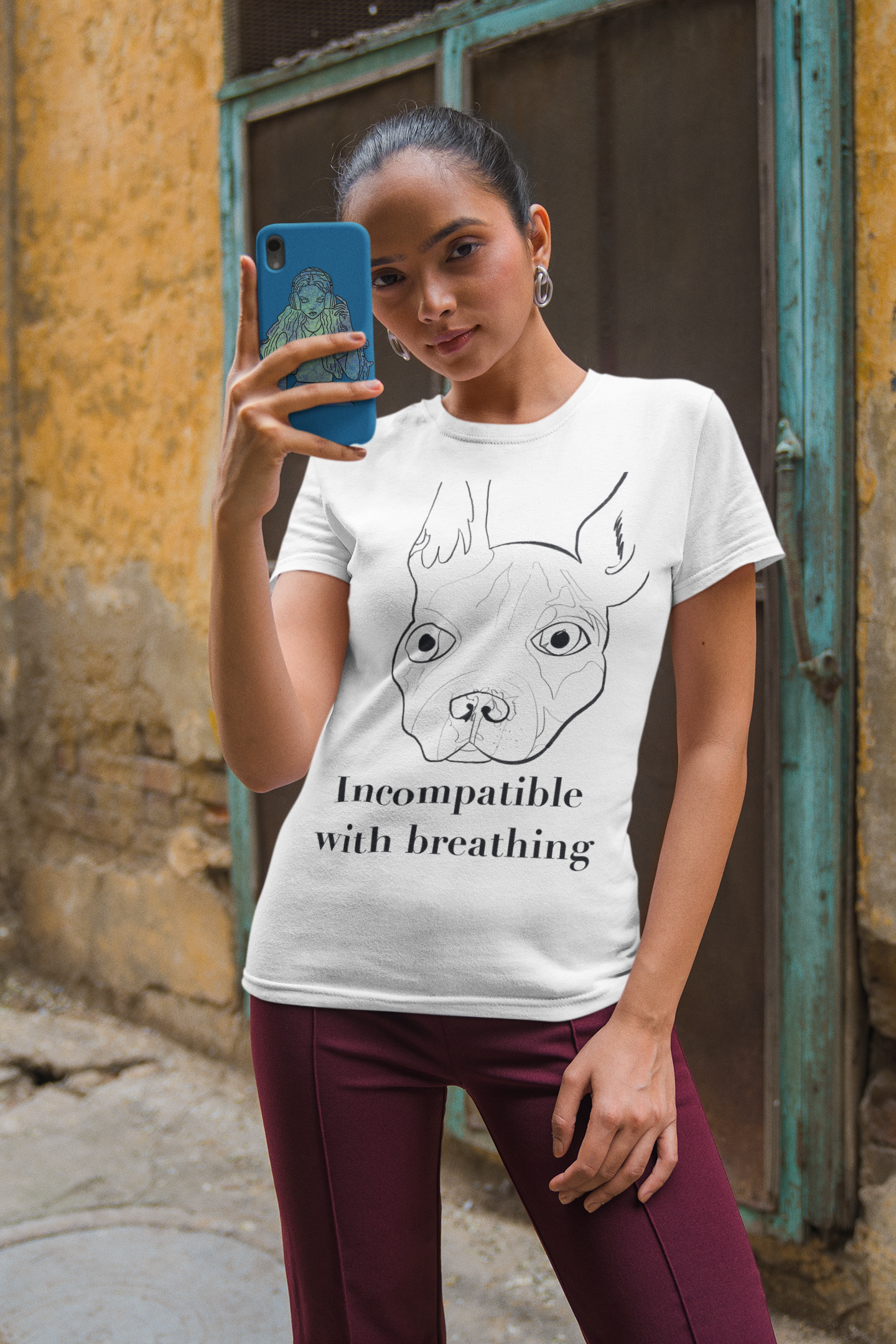 Woman with curly hair wearing white "Incompatible with Breathing" t-shirt with French Bulldog design – GrungePup Vet Chaos humor tee