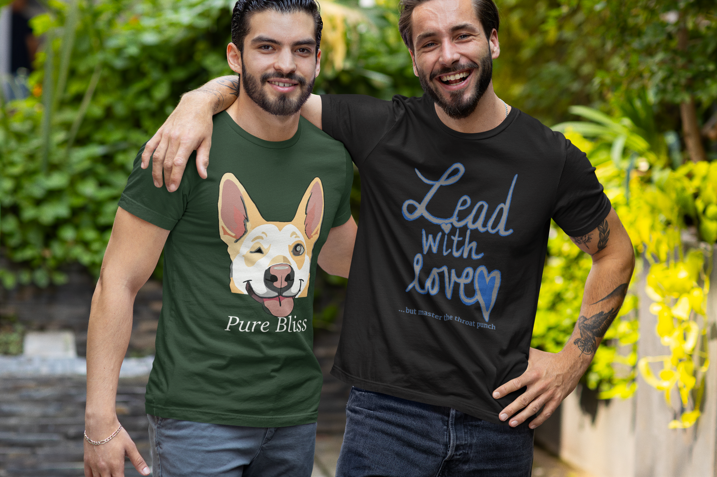 Two men friends smiling and posing in black heather Bella Canvas t-shirts with "Lead with Love… but master the throat punch" sarcastic self-care design. Unisex empowering message for boundaries and kindness.