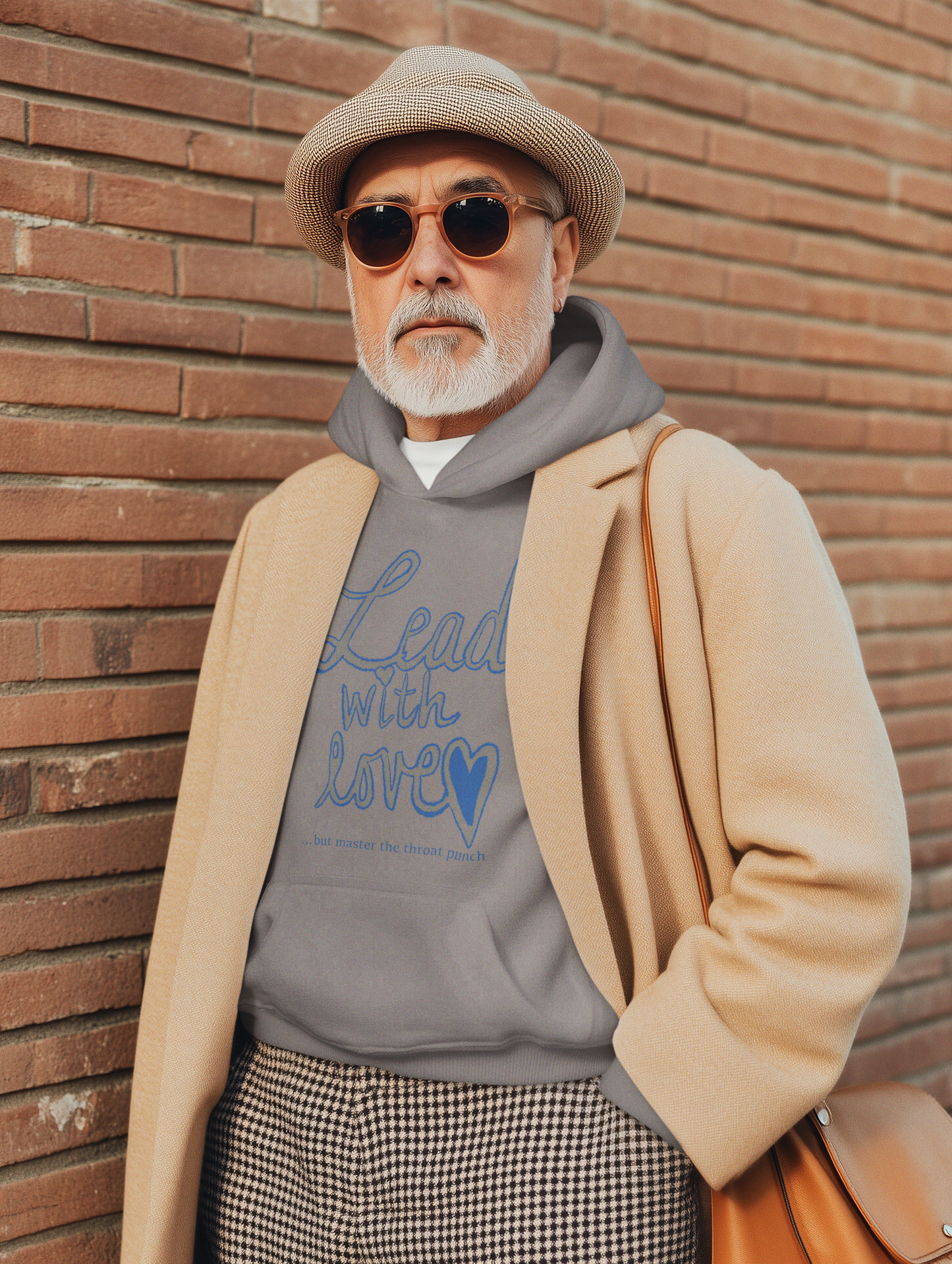 Man in grey Gildan 18500 hoodie wearing "Lead with Love… but master the throat punch" sarcastic self-care design. Bold message for empaths who protect their energy.