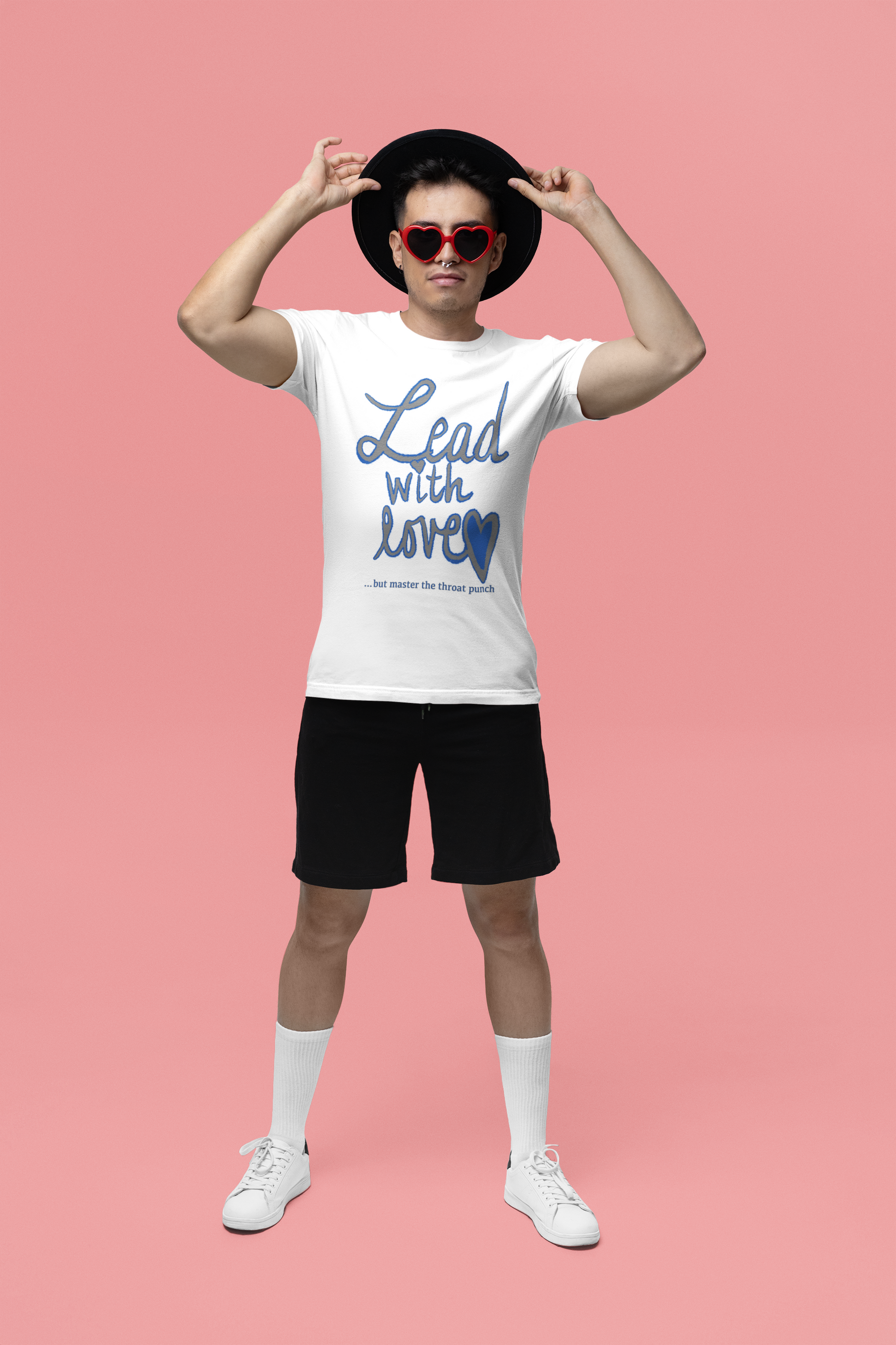 Man wearing heart shaped sunglasses and white Bella Canvas t-shirt with "Lead with Love… but master the throat punch" sarcastic self-care design. Fun, bold message for those who lead with love but set strong boundaries.