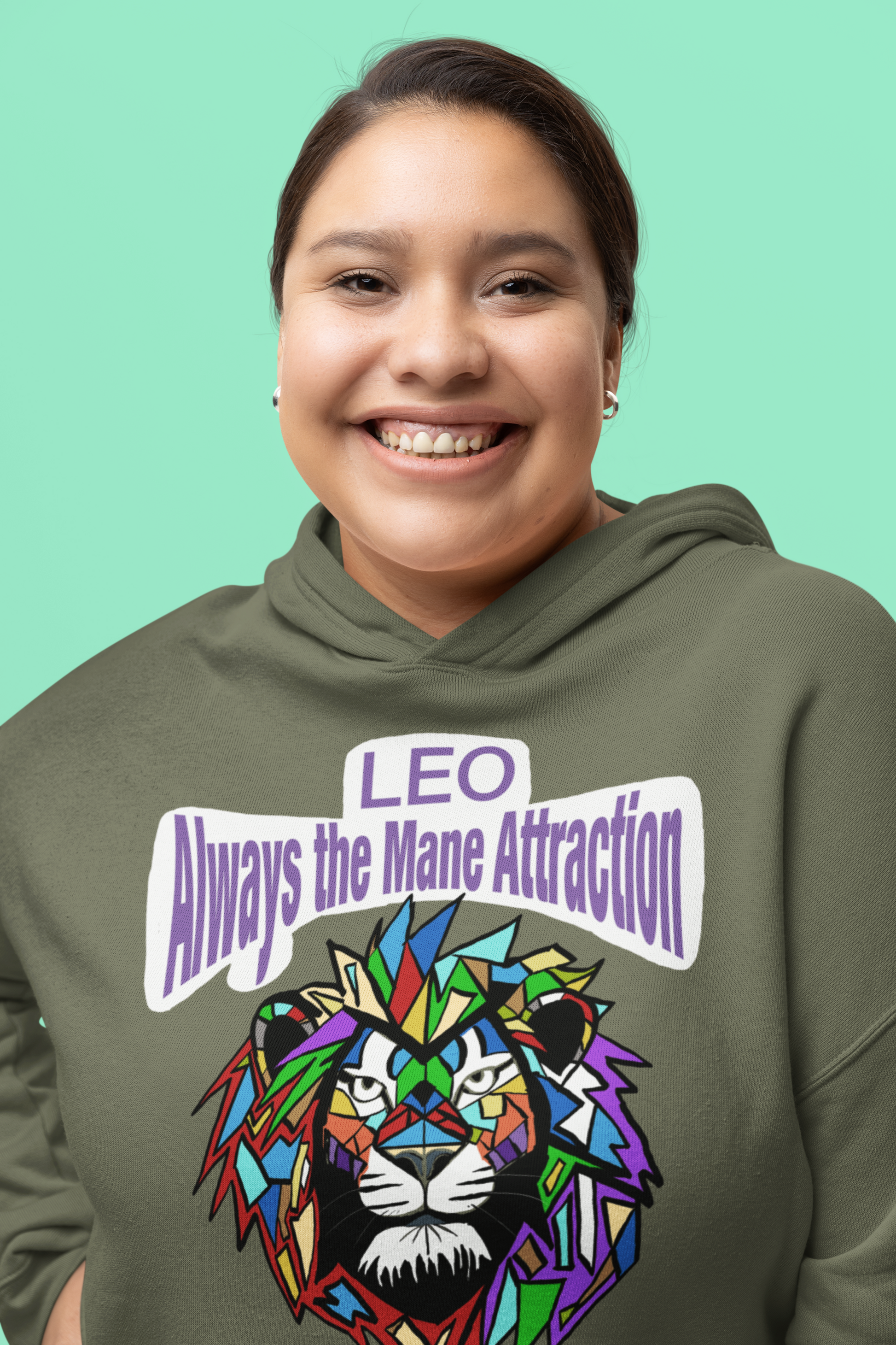 Close-up of a smiling woman wearing a Military Green Bella + Canvas 7502 cropped hoodie with the Leo Always the Mane Attraction design