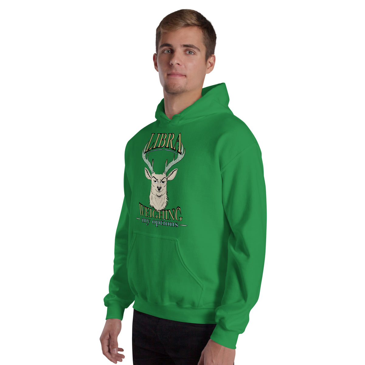 Man wearing an Irish green Libra Weighing My Options hoodie with cream stag, mint antlers, and gold lettering.