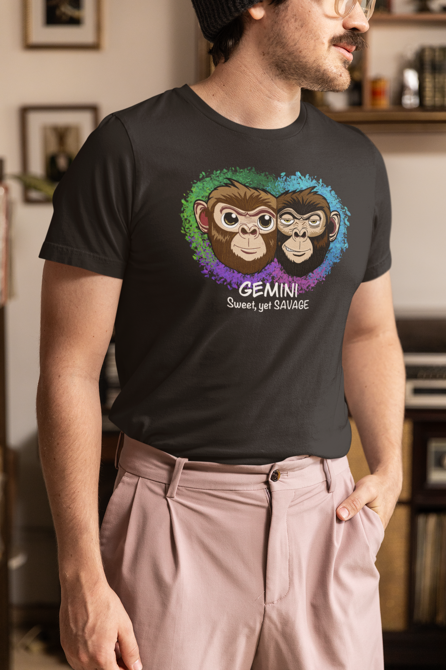 Man with glasses and beanie wearing a black Gemini "Sweet, yet SAVAGE" t-shirt in a vintage grandpacore inspired setting