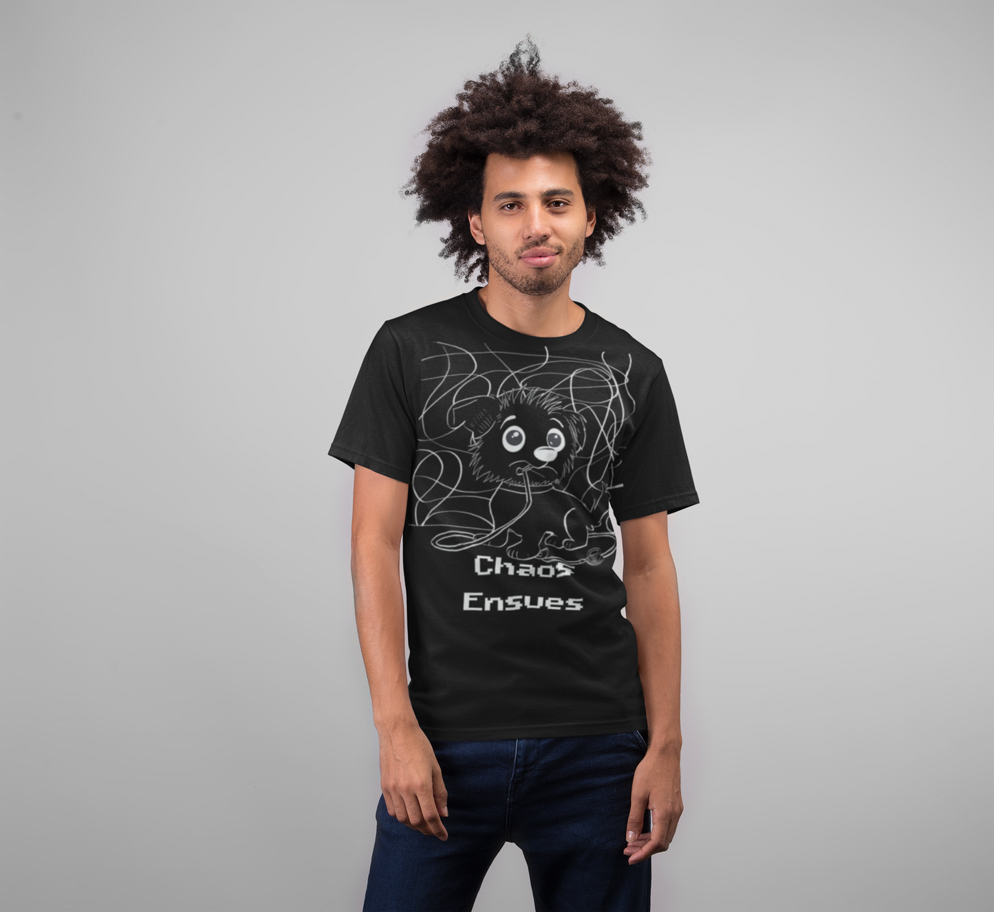 Man with afro wearing black Chaos Ensues t-shirt with white ink design in studio