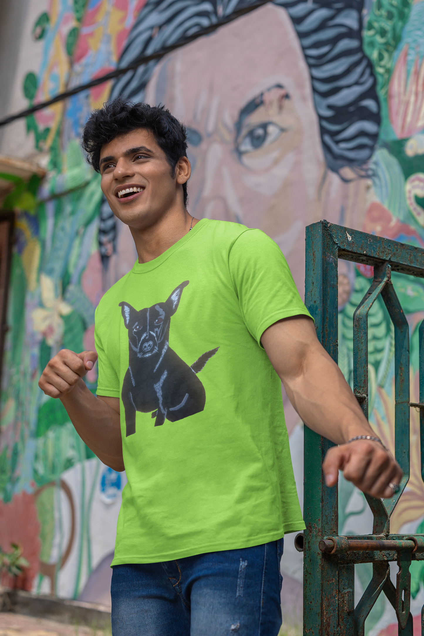 Man standing in front of graffiti wall wearing lime green Mathis Pet Portrait t-shirt