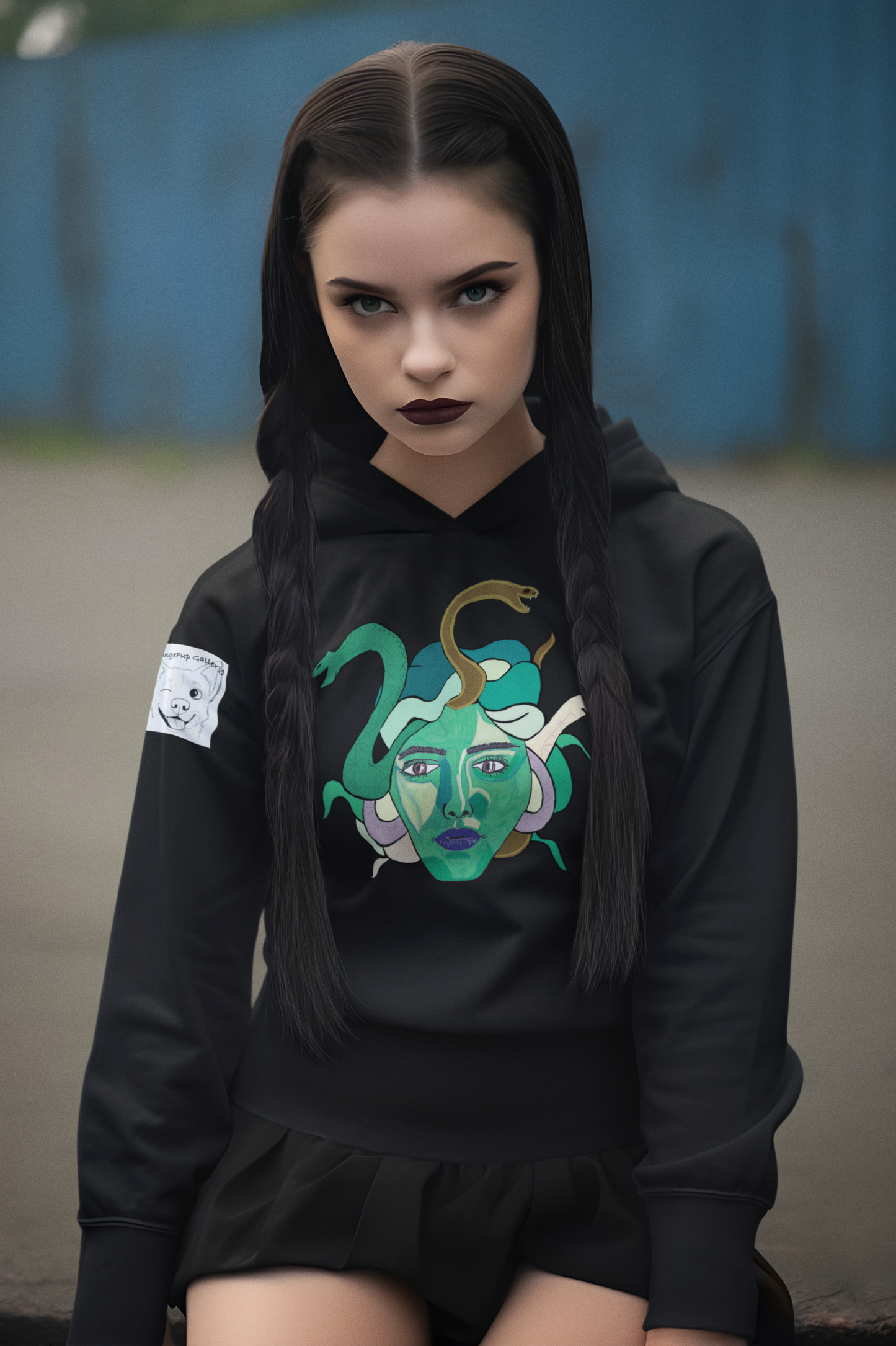 Woman with dark braids and Wednesday-style makeup wearing a black Medusa hoodie by GrungePup Gallery