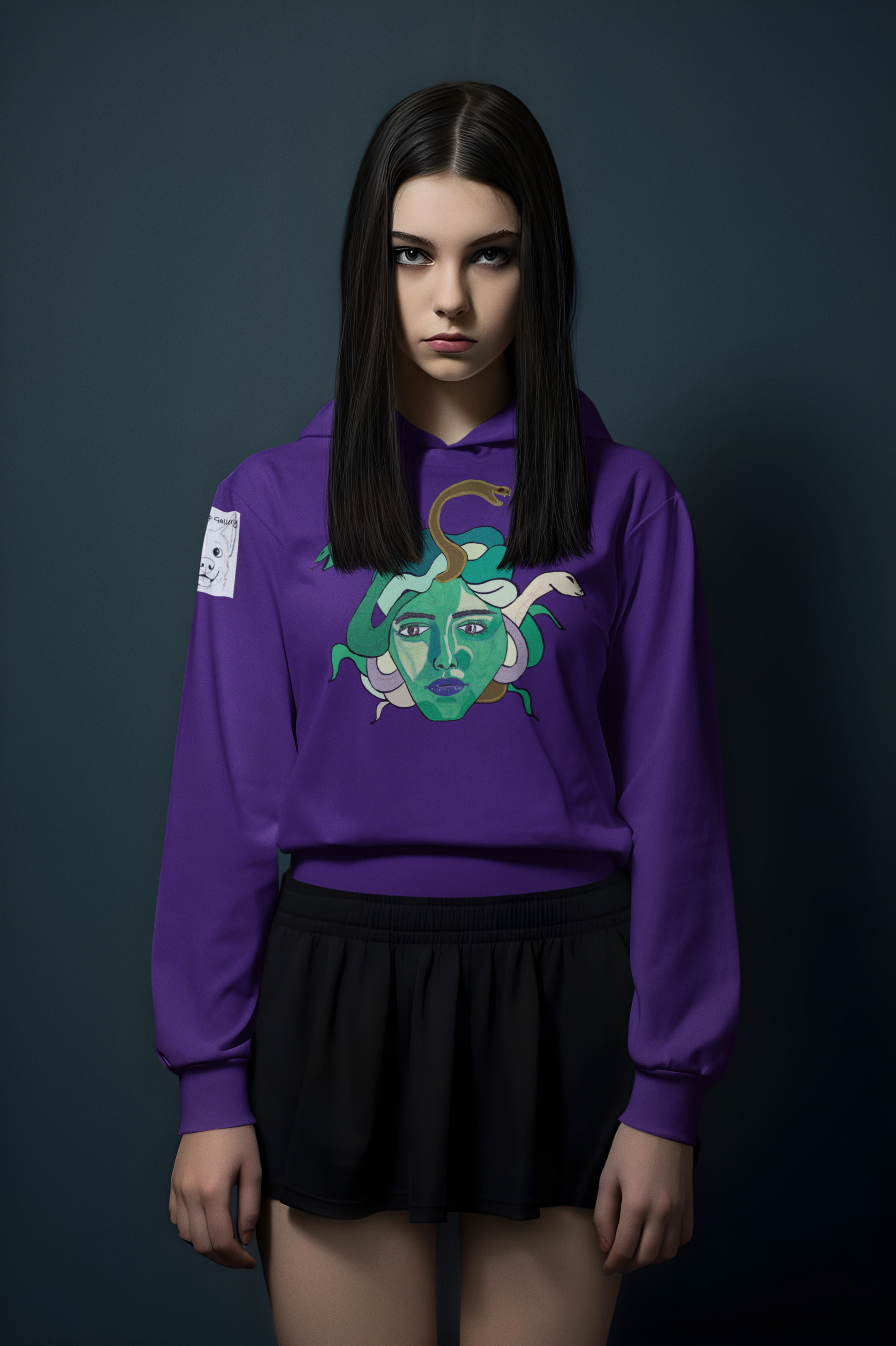 Woman with straight dark hair posing in a studio, wearing a purple Medusa hoodie by GrungePup Gallery