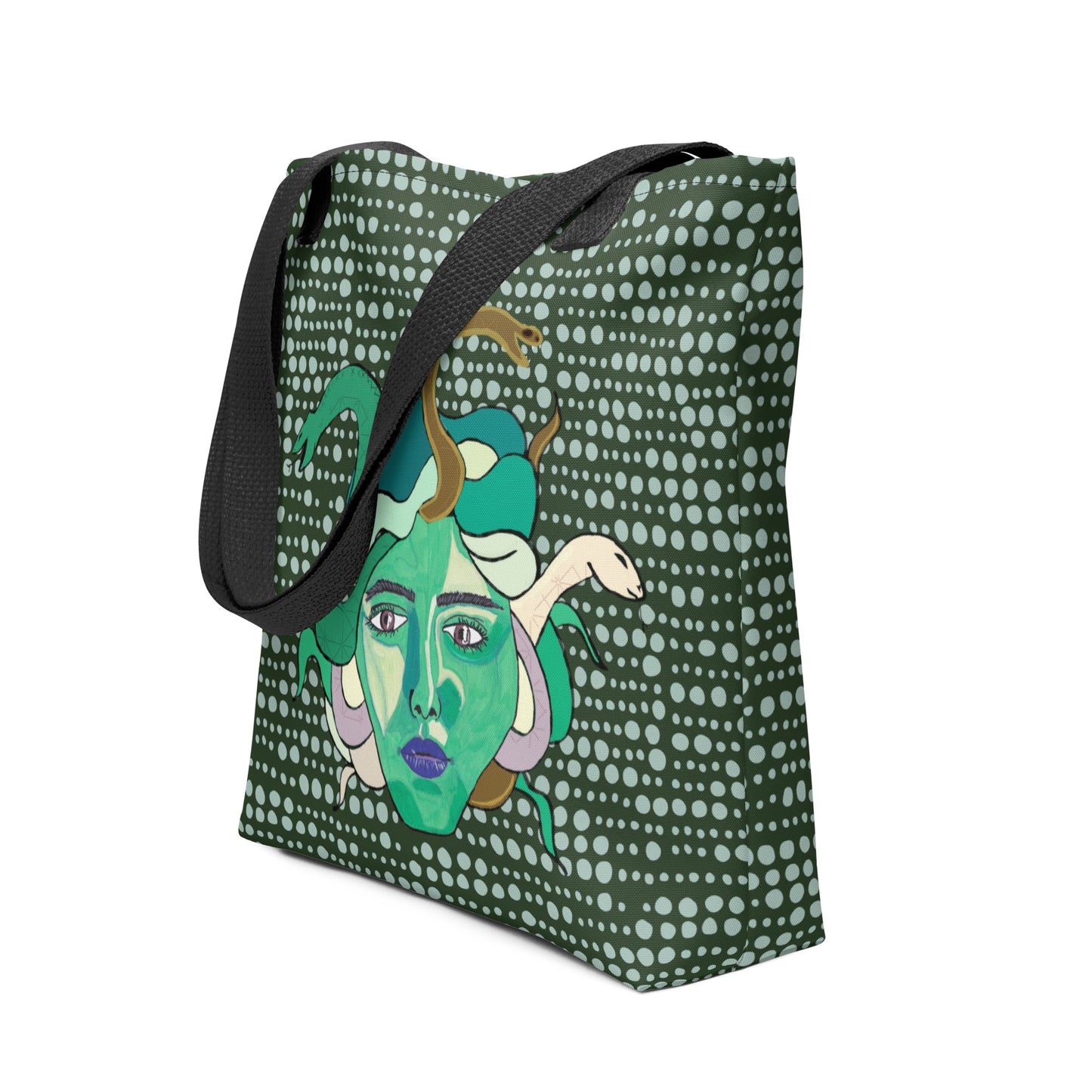 Side angle of the Medusa all-over print tote bag showing the dark green dotted background and black strap by GrungePup Gallery