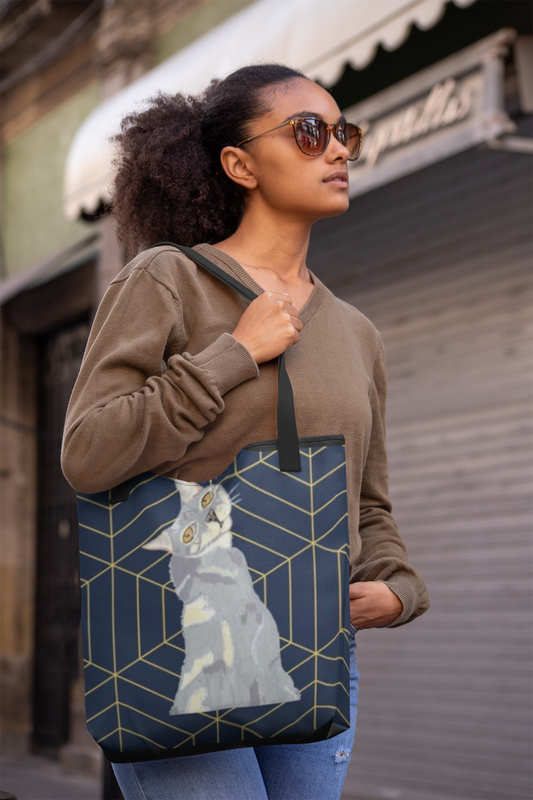 Woman in brown sweater carrying Mr. Grey Cat all-over print tote bag outdoors