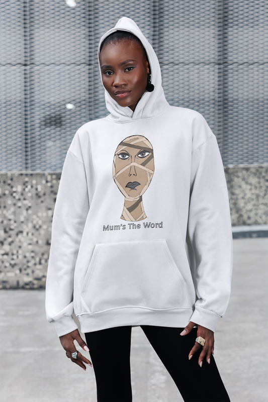 Woman in a white hoodie with the hood up standing on a sidewalk, mummy face and Mum’s The Word print on the chest