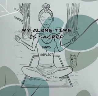 A minimalist line art illustration of a woman meditating cross-legged on a mat in a forest setting, with the text 'MY ALONE TIME IS SACRED' and 'PAWS + REFLECT' printed on her tank top.