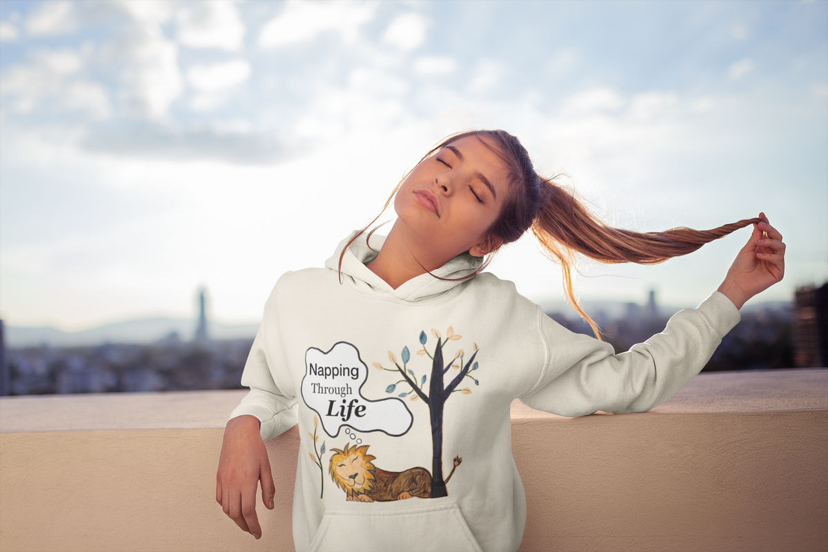 Oatmeal Heather hoodie catching the sun on a rooftop. Eyes closed, holding ponytail, pure Napping Through Life mood.