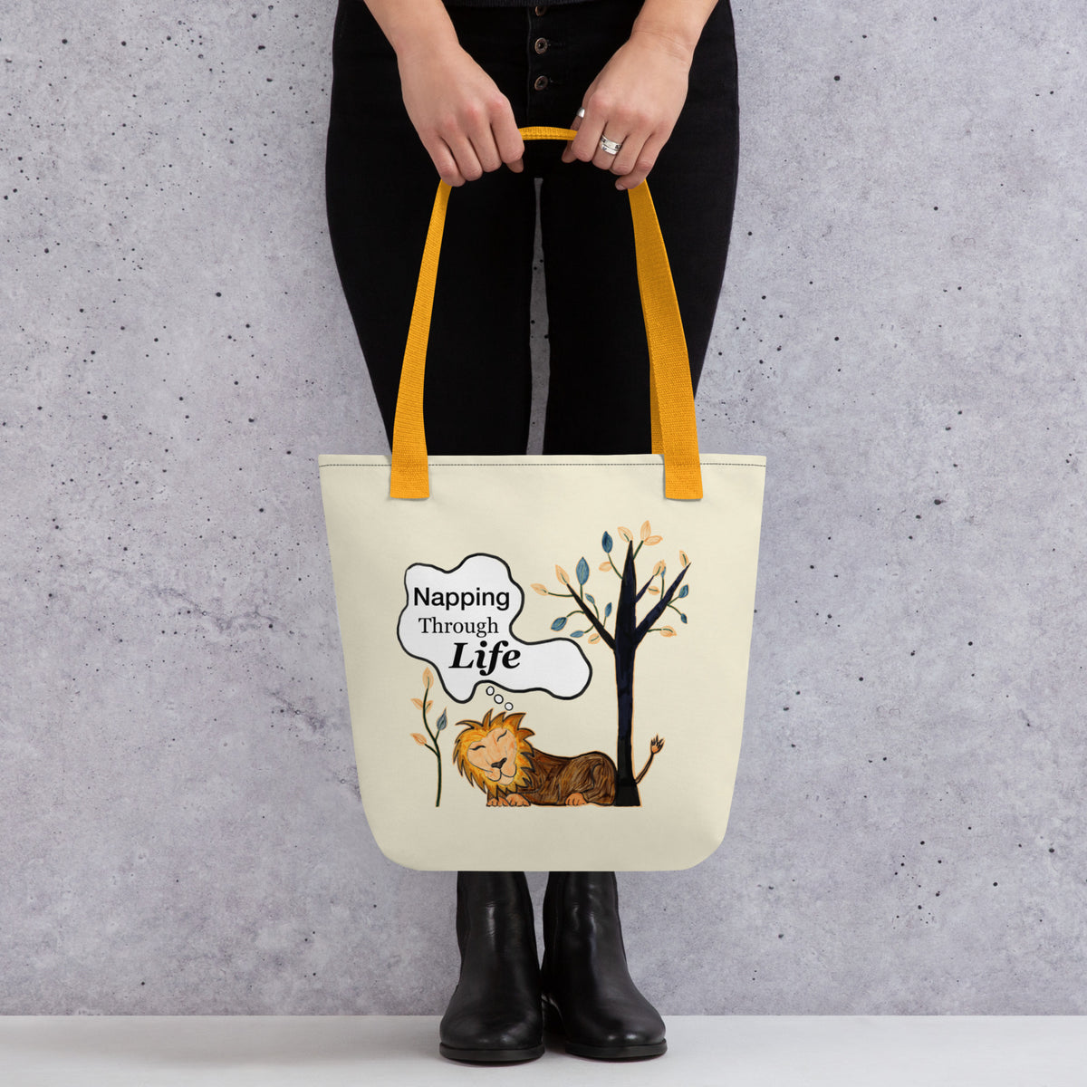 Cream tote with yellow straps featuring the Napping Through Life design. Clean product shot highlighting the full front print and contrasting straps.
