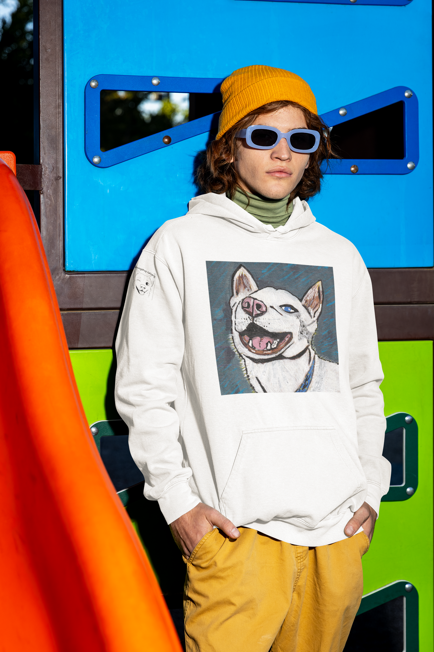 Man wearing orange hat and white Nico Face hoodie with husky portrait