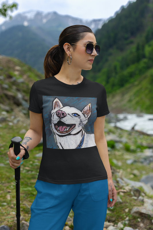 Woman standing on mountain trail wearing black Nico Face t-shirt with joyful husky portrait