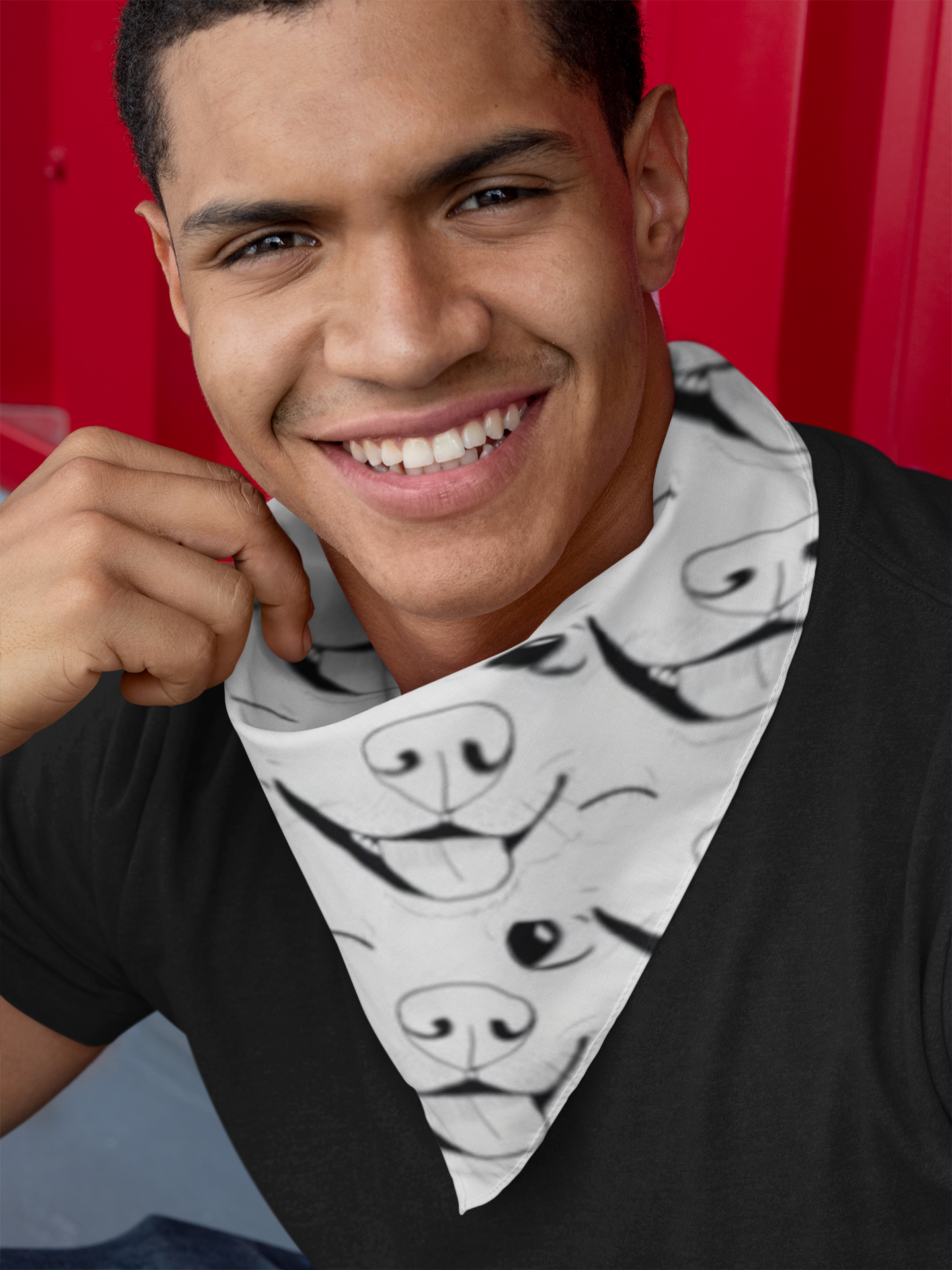 Man wearing Nico Inspired all-over print bandana tied around his neck