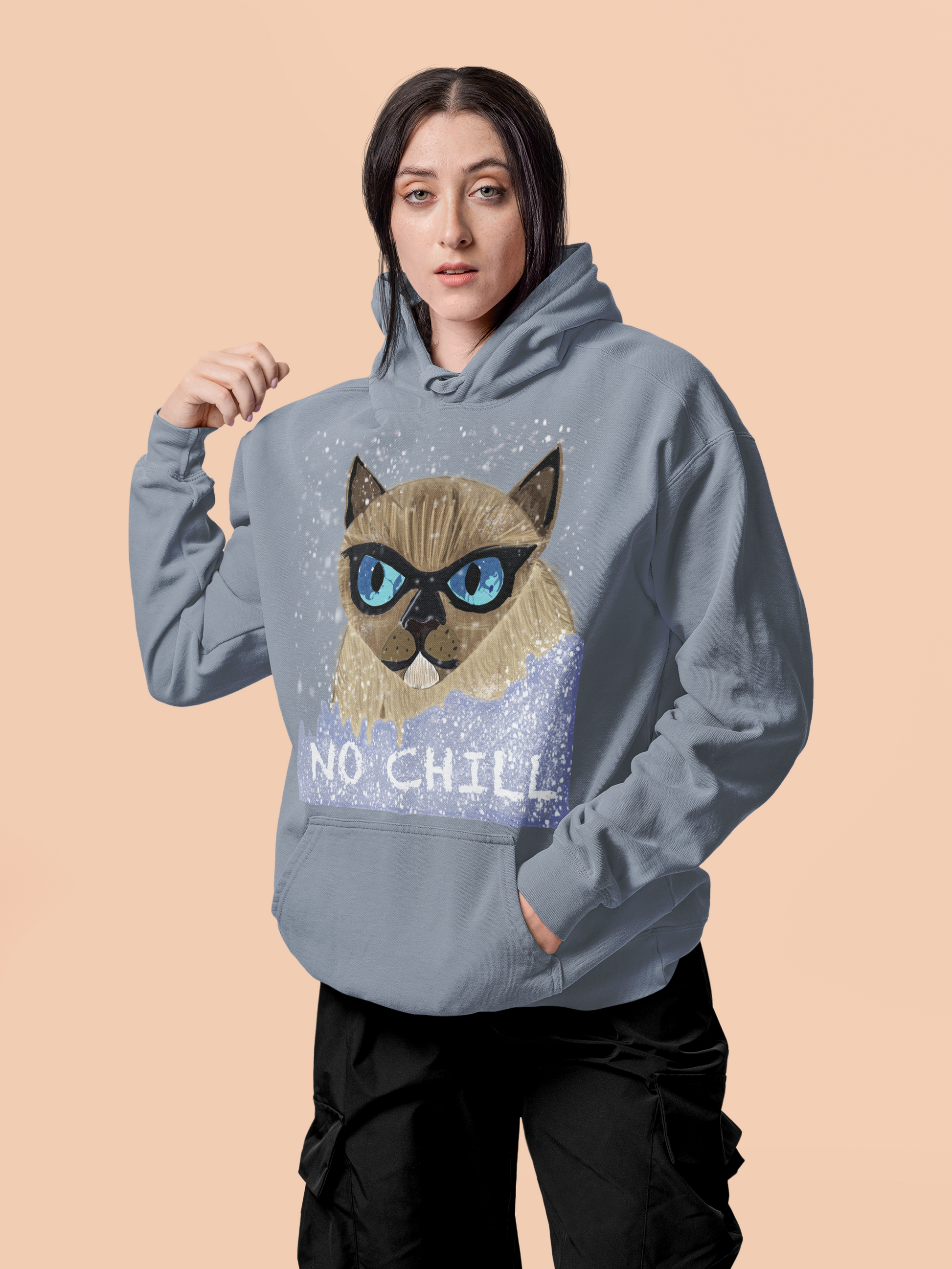 Woman wearing blue jean colored No Chill Cat hoodie posing with hand on shoulder