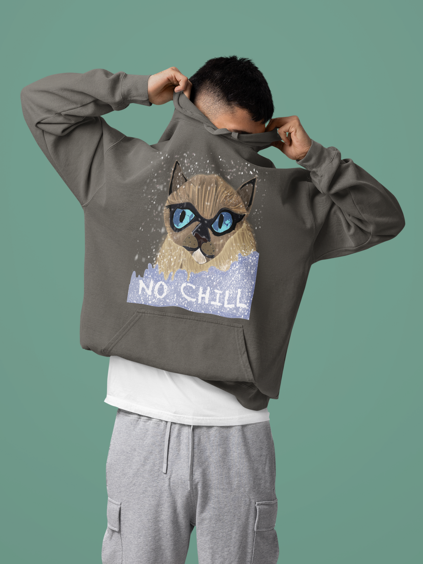 Man pulling hood over head while wearing pepper gray No Chill Cat hoodie