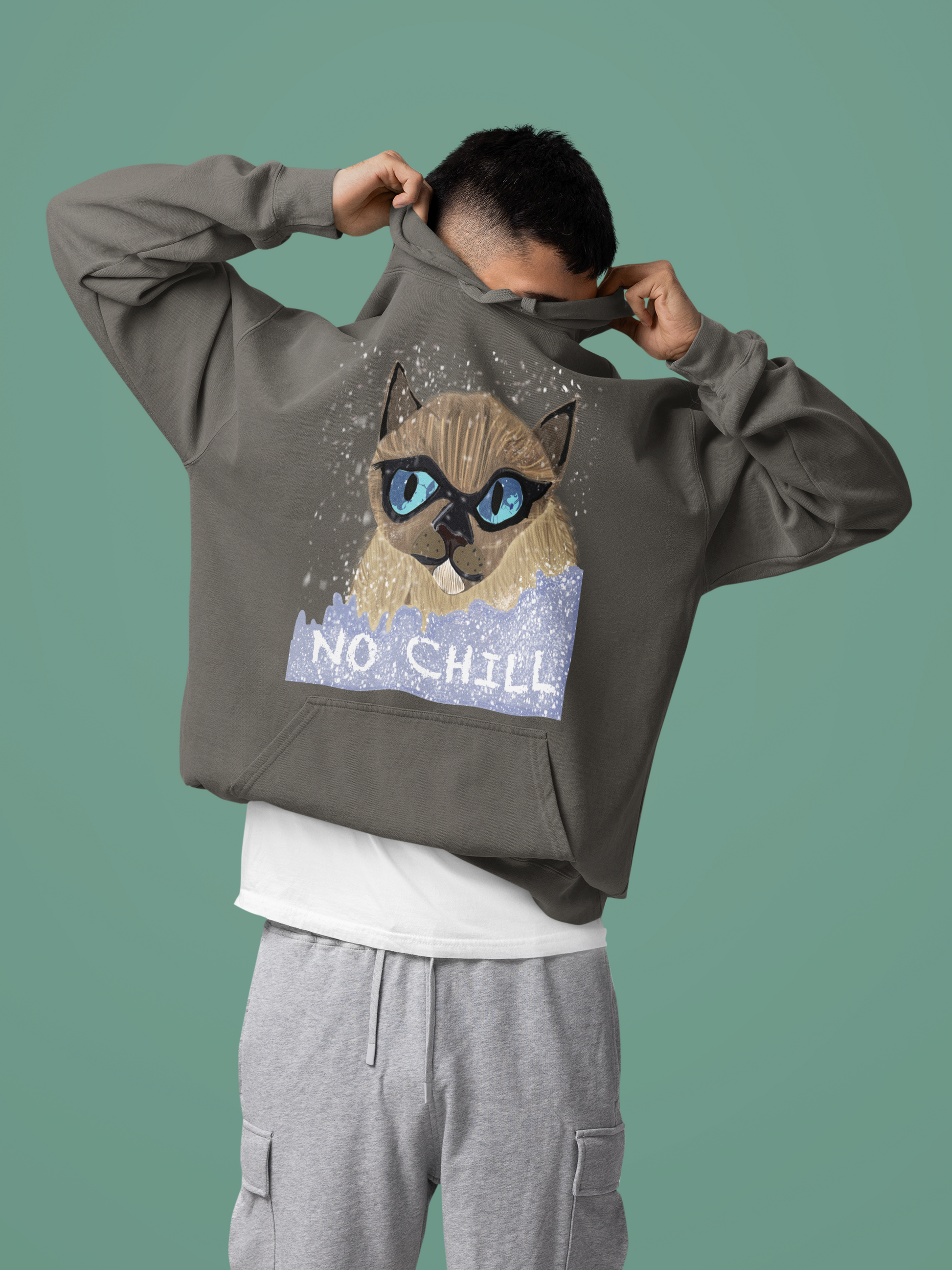 Man pulling hood over head while wearing pepper gray No Chill Cat hoodie