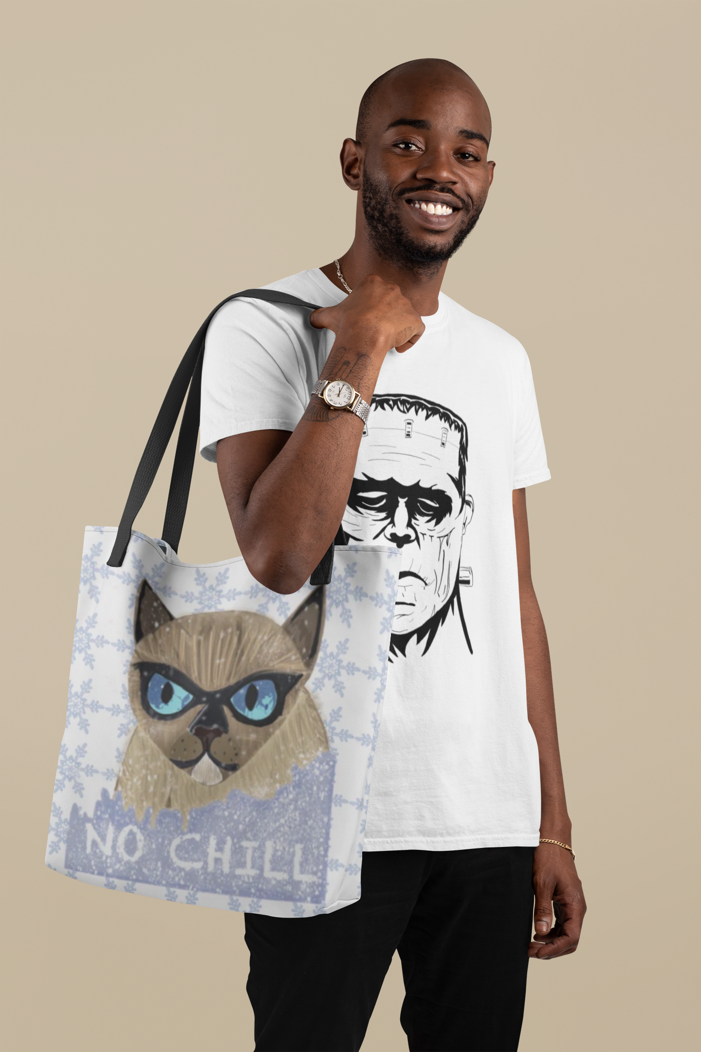 Smiling man with beard holding the No Chill Cat snowflake tote bag over his shoulder