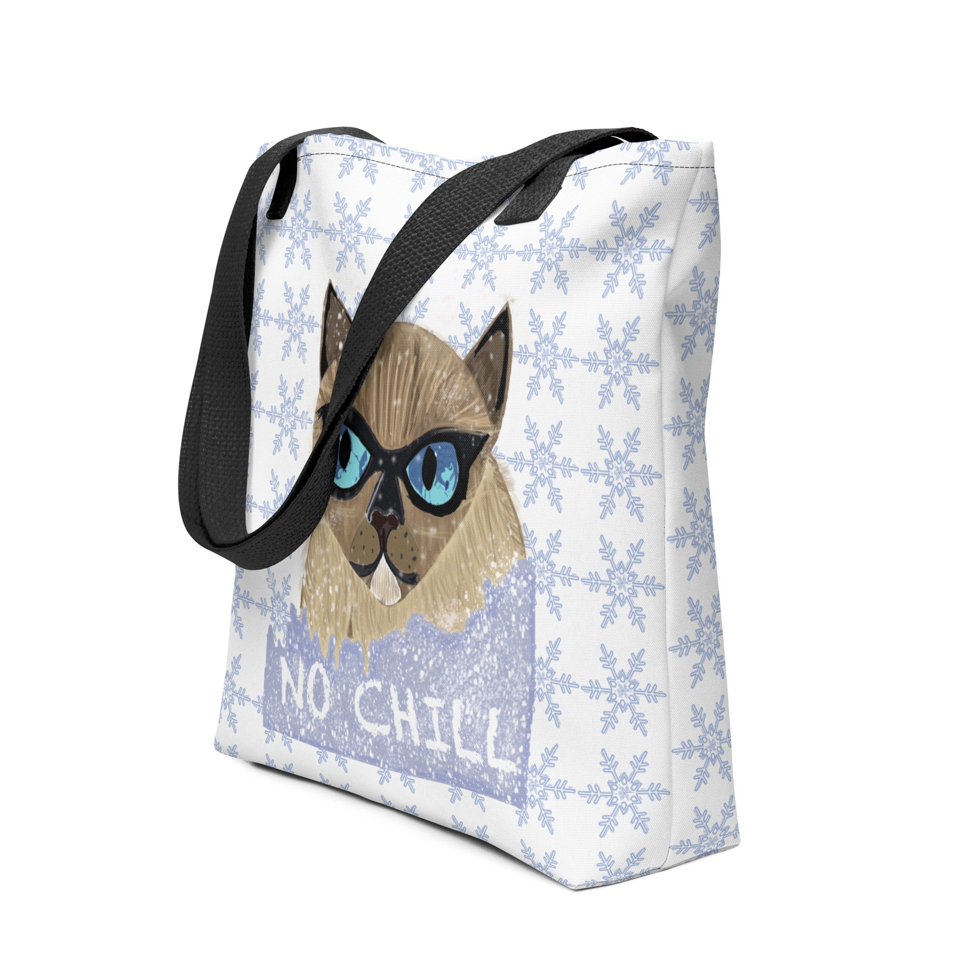 Side angle of the No Chill Cat snowflake tote bag showing the depth and black handle