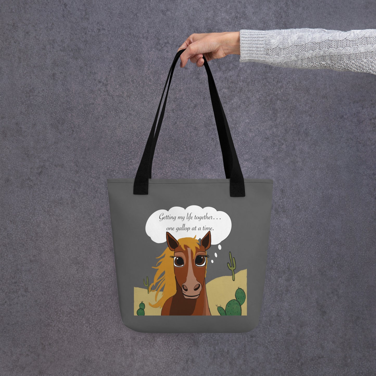 Gray all-over print tote bag with black straps showing full cartoon horse design and motivational text