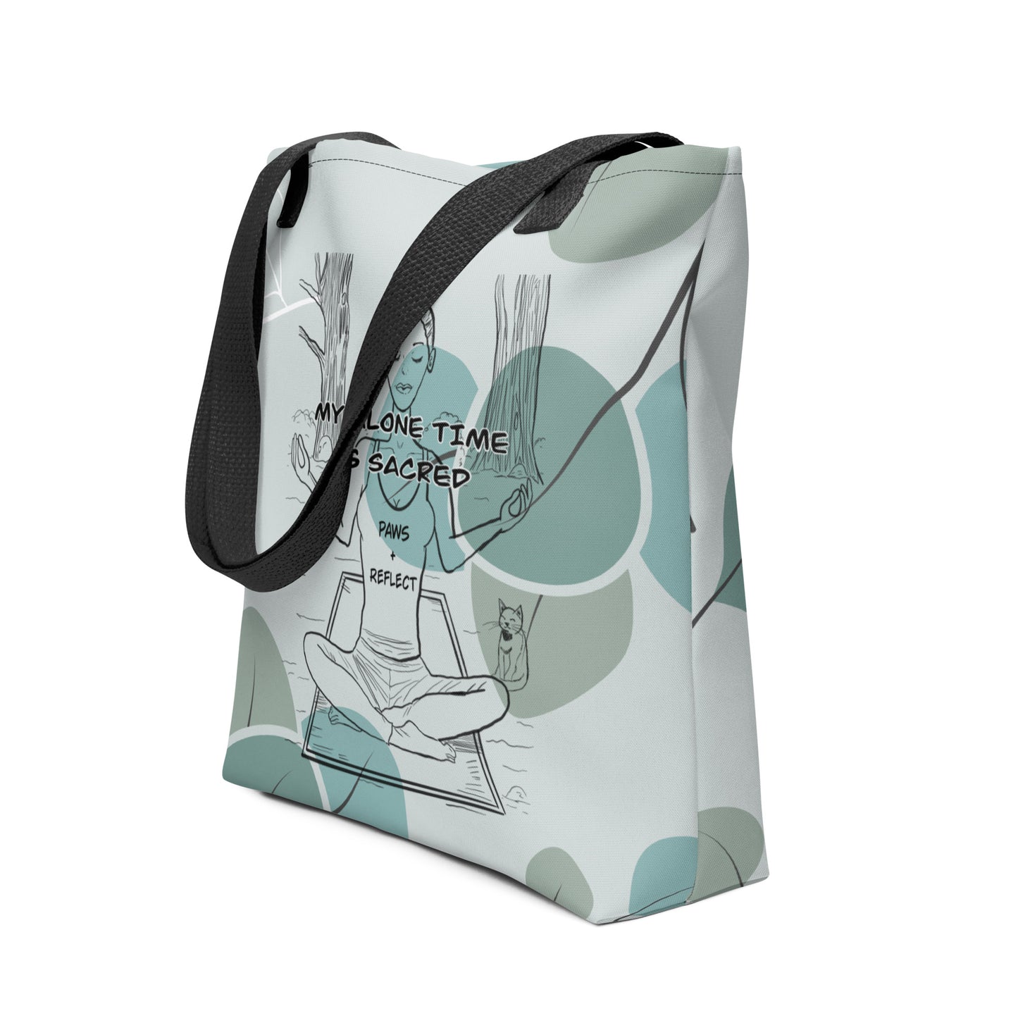 Side angle view of the sage green eucalyptus all-over print tote bag with the darker Paws & Reflect “My Alone Time is Sacred” design and black straps