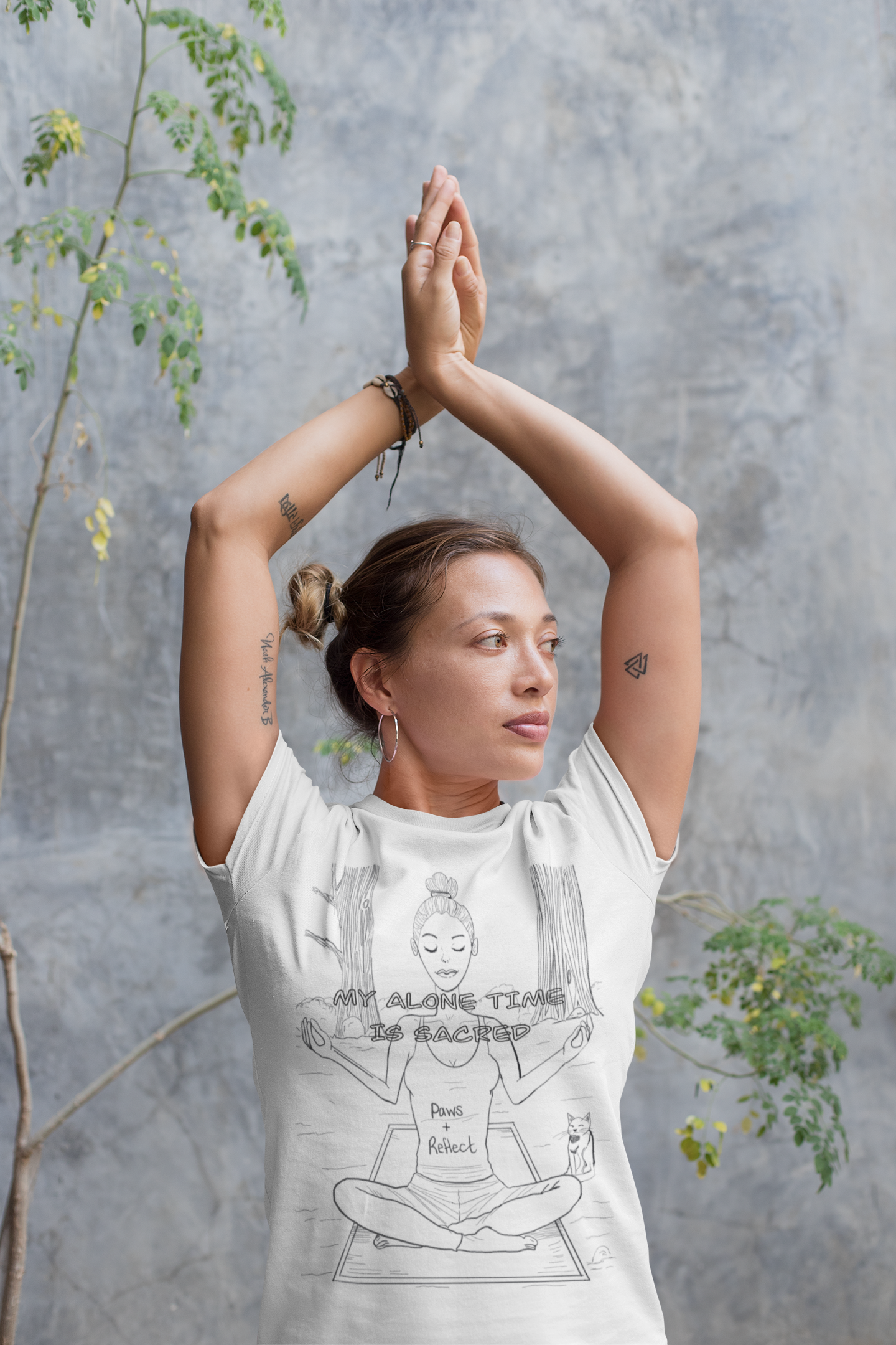 Woman in prayer pose wearing white "Paws and Reflect – My Alone Time is Sacred" t-shirt with meditation line art – GrungePup Vet Chaos calm sarcastic apparel