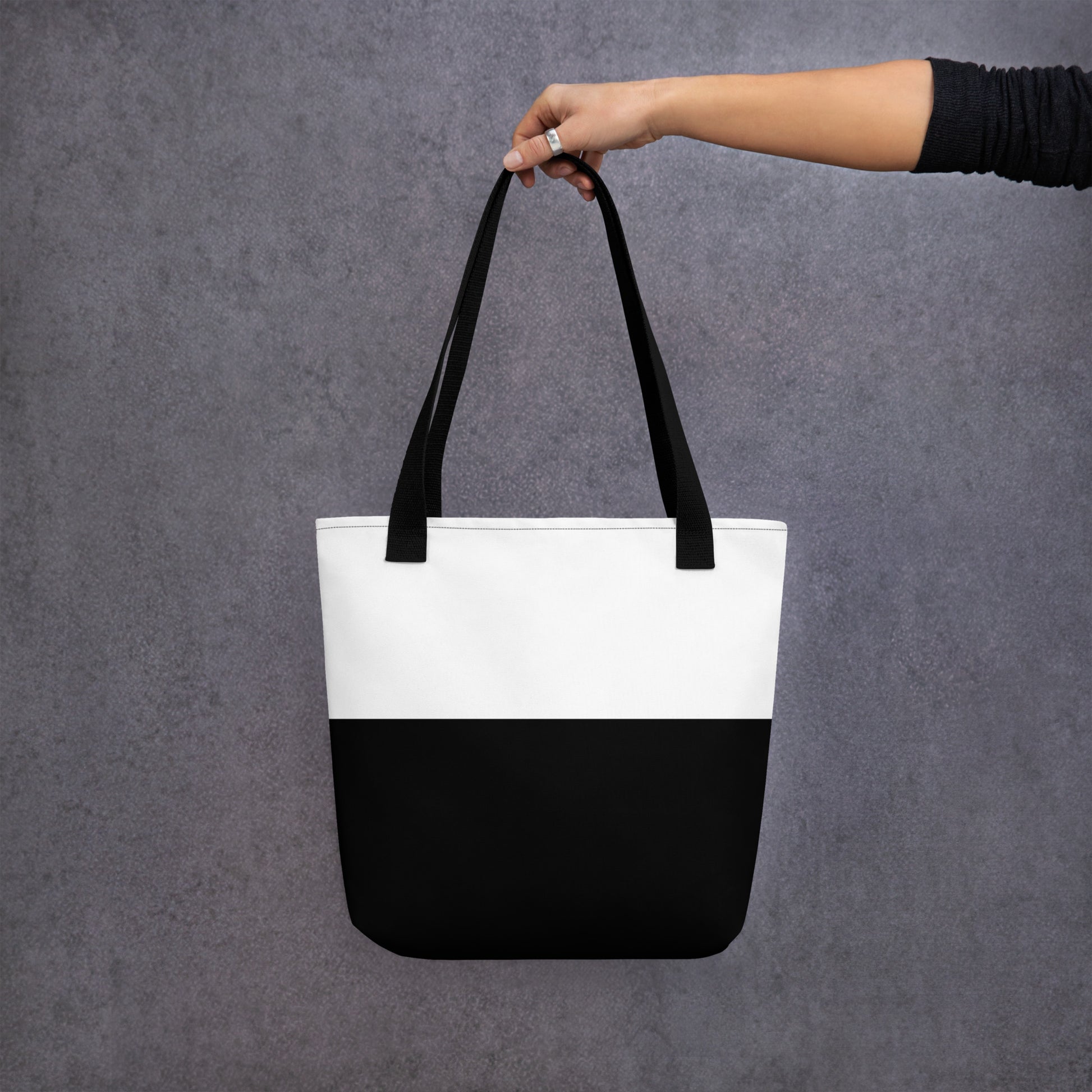 Back view of Pure Bliss Nico Face all-over print tote bag showing plain black surface with no graphics