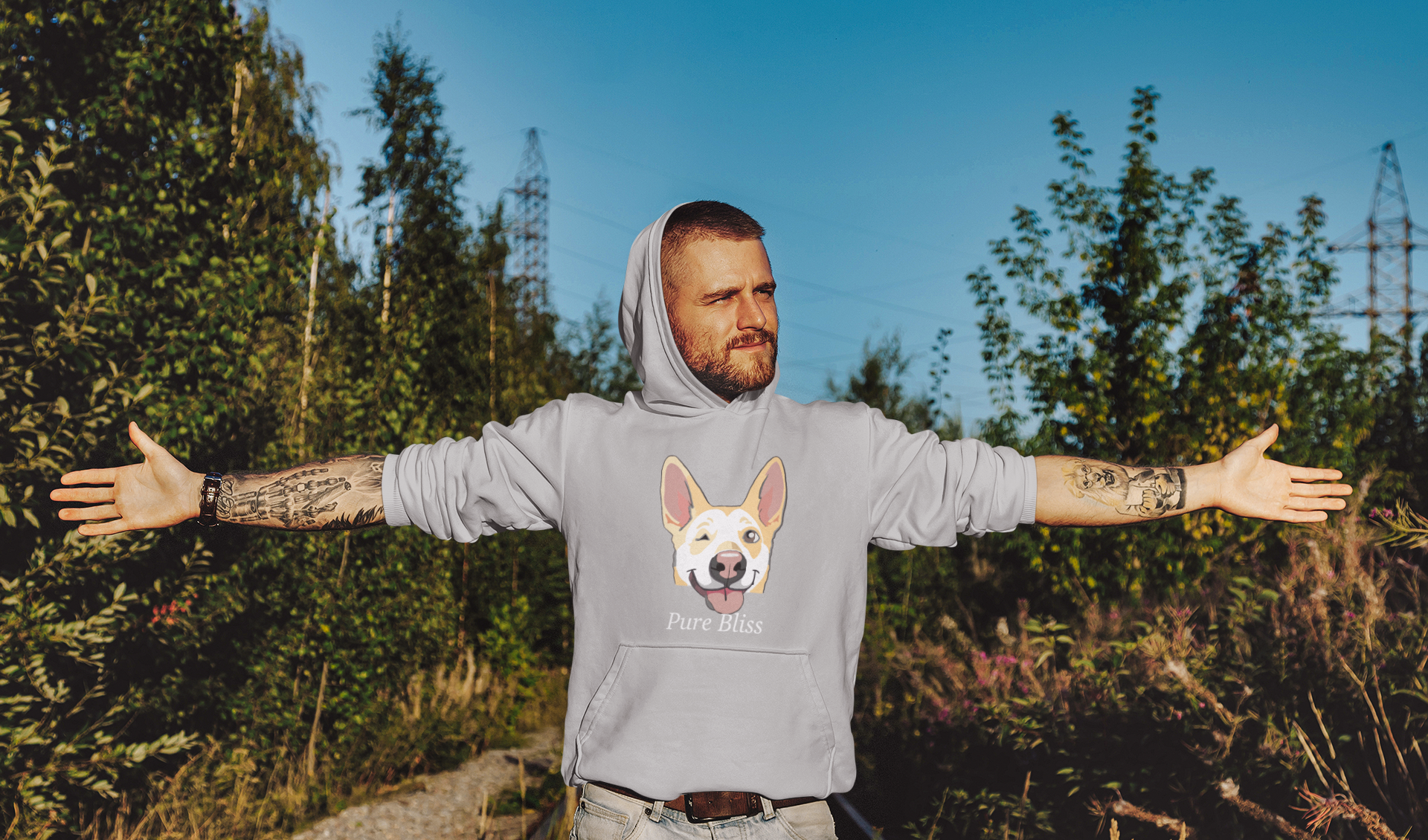 Man standing with arms stretched wearing athletic heather Pure Bliss Nico Face hoodie
