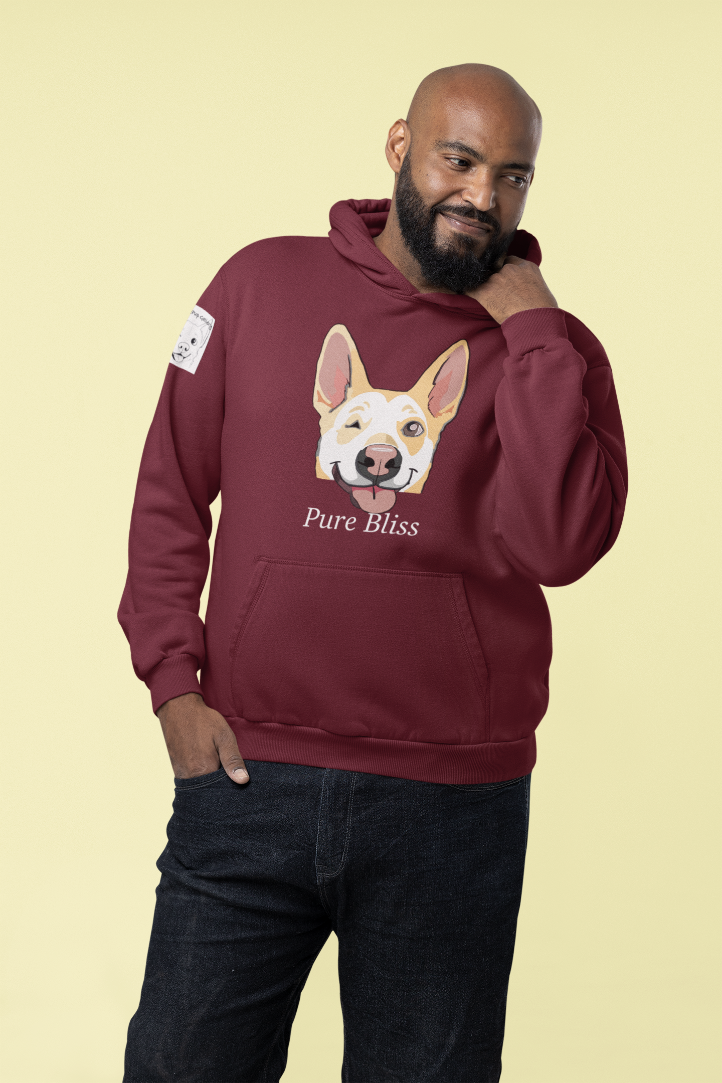 Man standing wearing maroon Pure Bliss Nico Face hoodie with joyful husky portrait