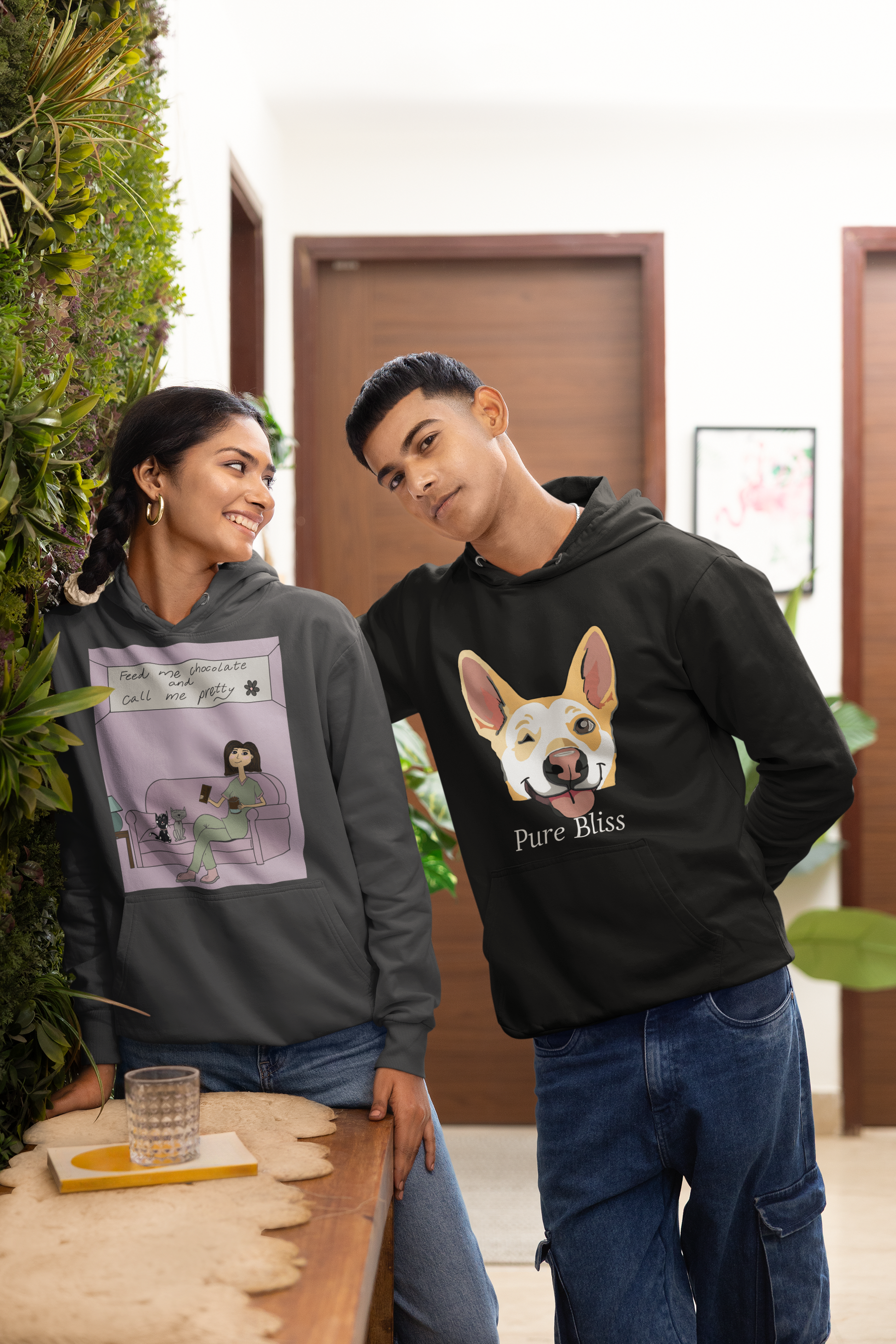 Couple posing together with man wearing black Pure Bliss Nico Face hoodie