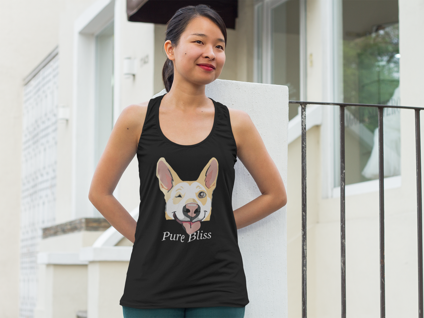 Asian woman standing outdoors wearing black Pure Bliss Nico Face racerback tank top
